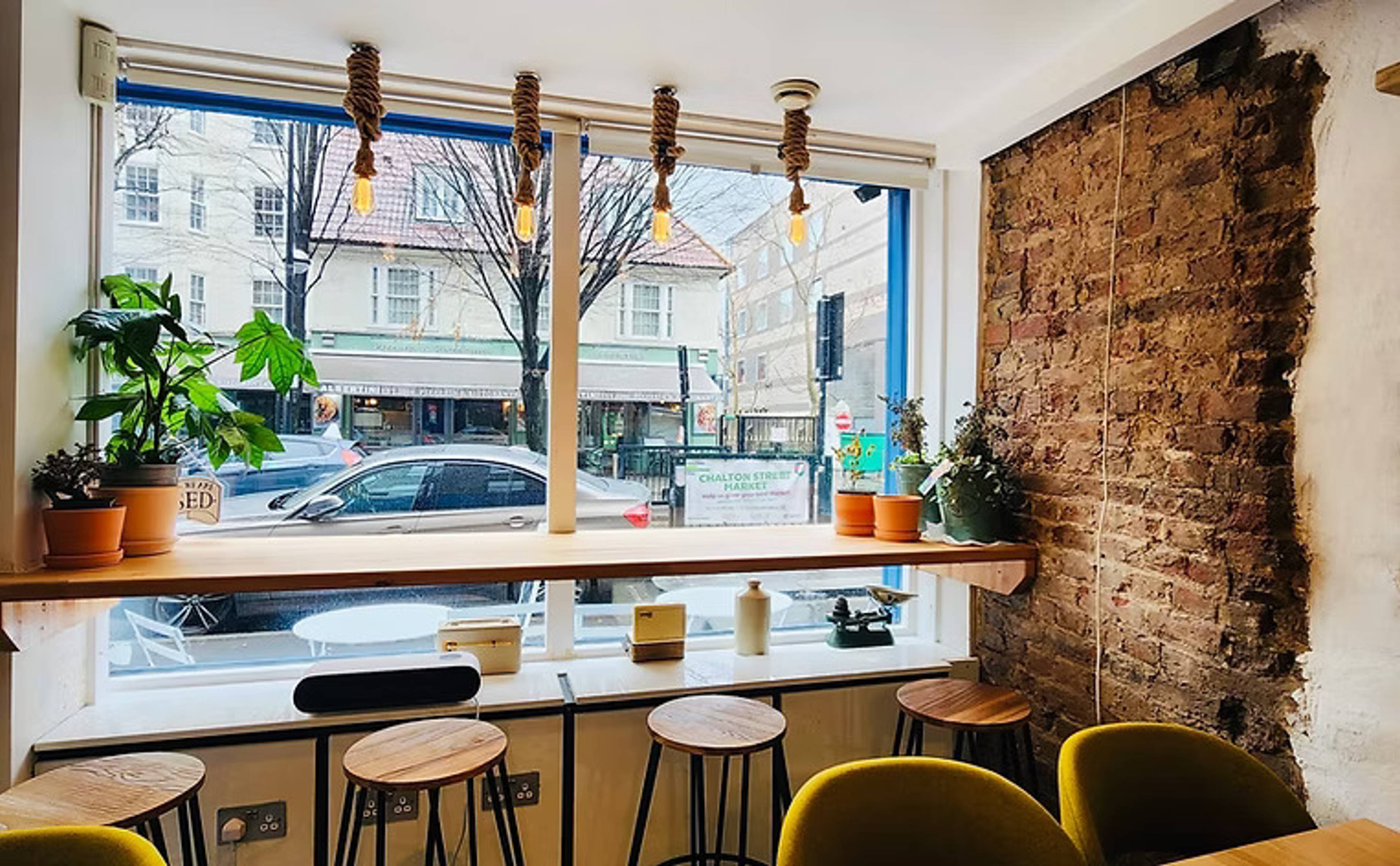 Al Grano Coffee House - Interior tables looking outside