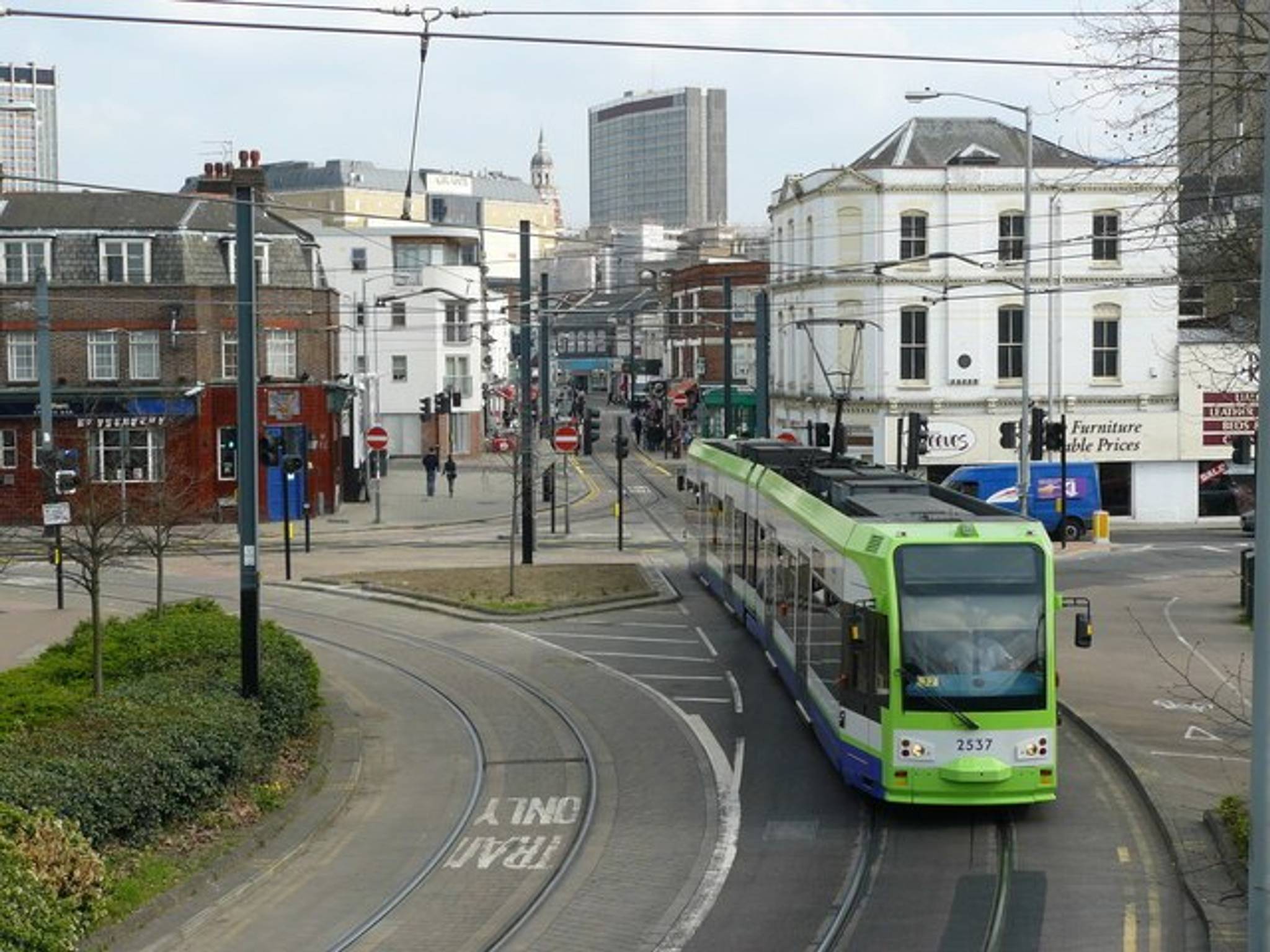 Tram at Reeves Corner, Croydon Tram passes Reeves Corner as it leaves Croydon for Wimbledon.