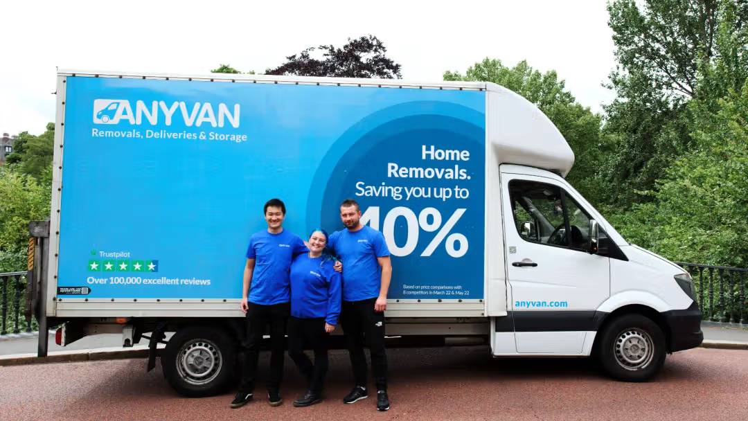 anyvan team in front of removals van