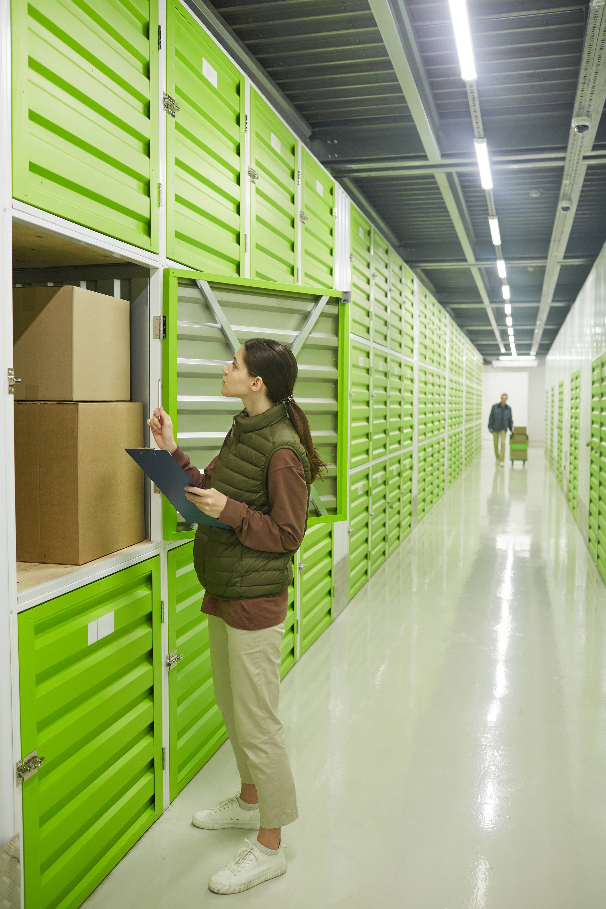 Woman next to small storage unit