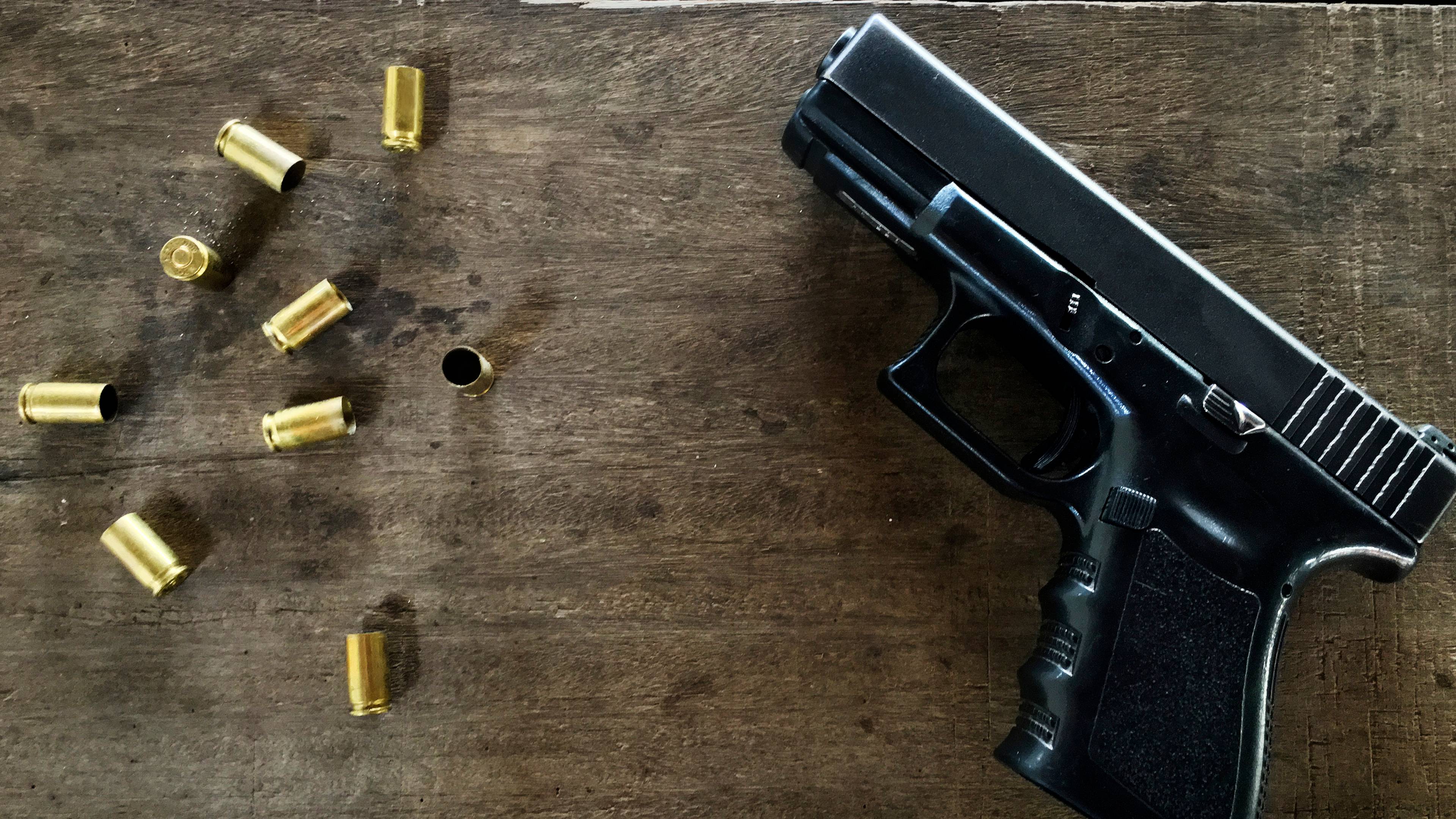 gun and ammunition on tabe