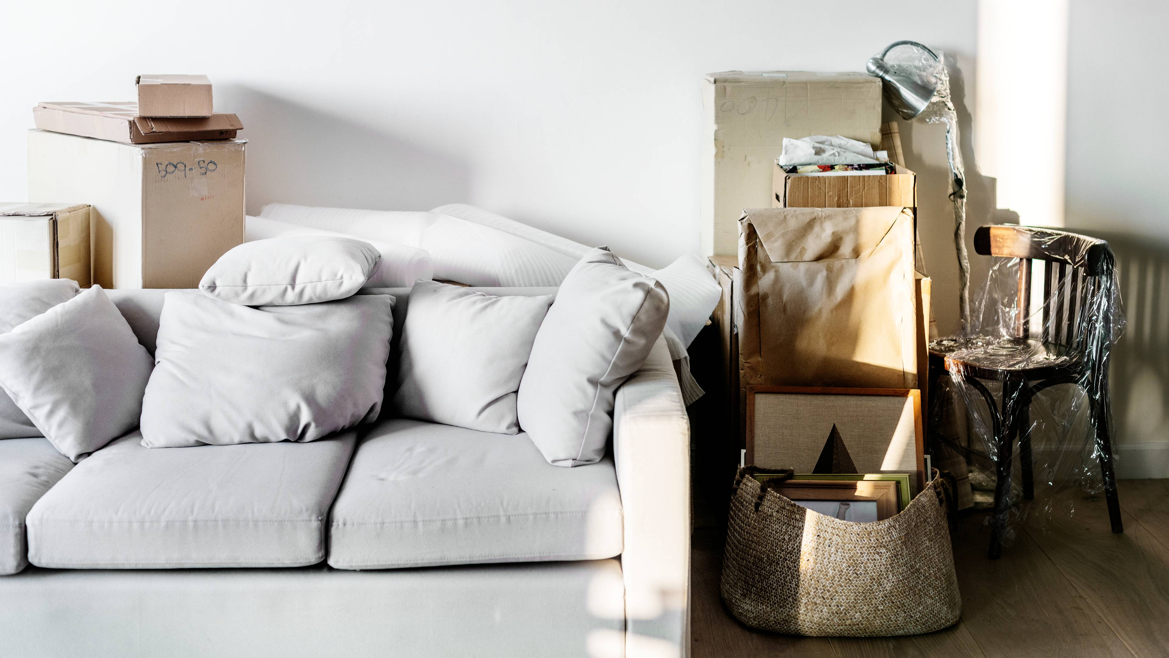 Sofa next to items ready for storage