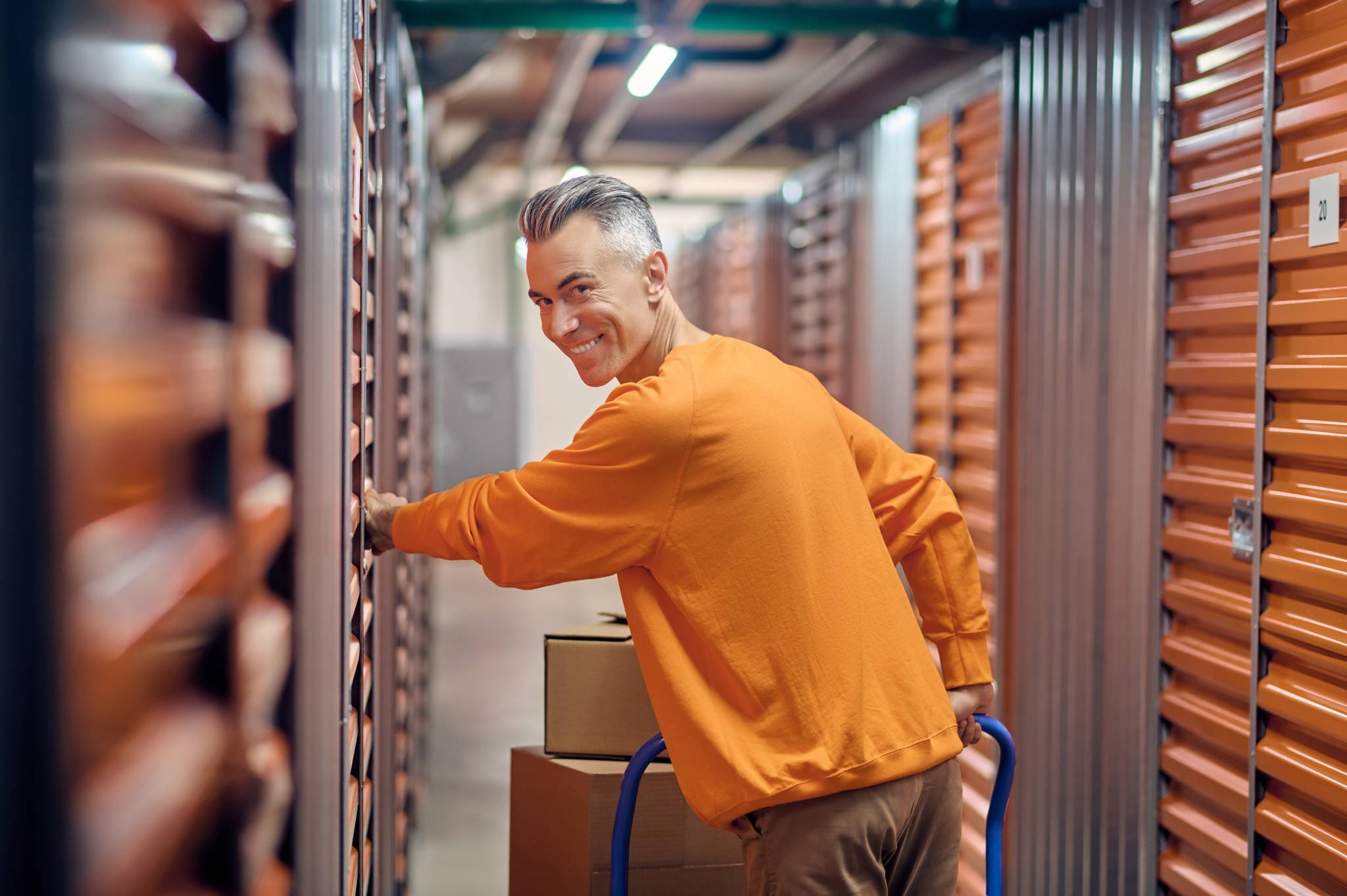 happy man in storage facility