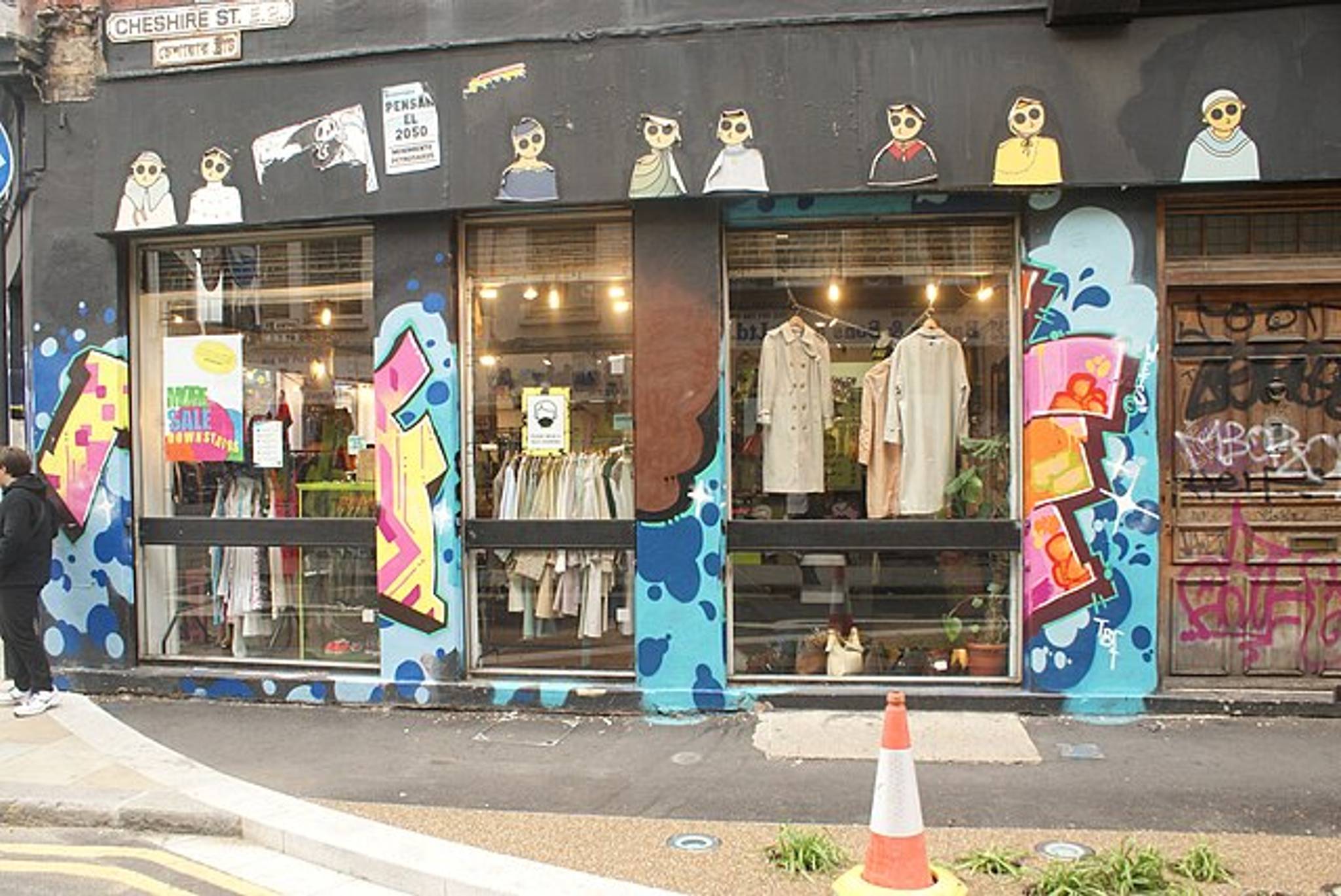 View of street art on the side of a clothes shop on Cheshire Street