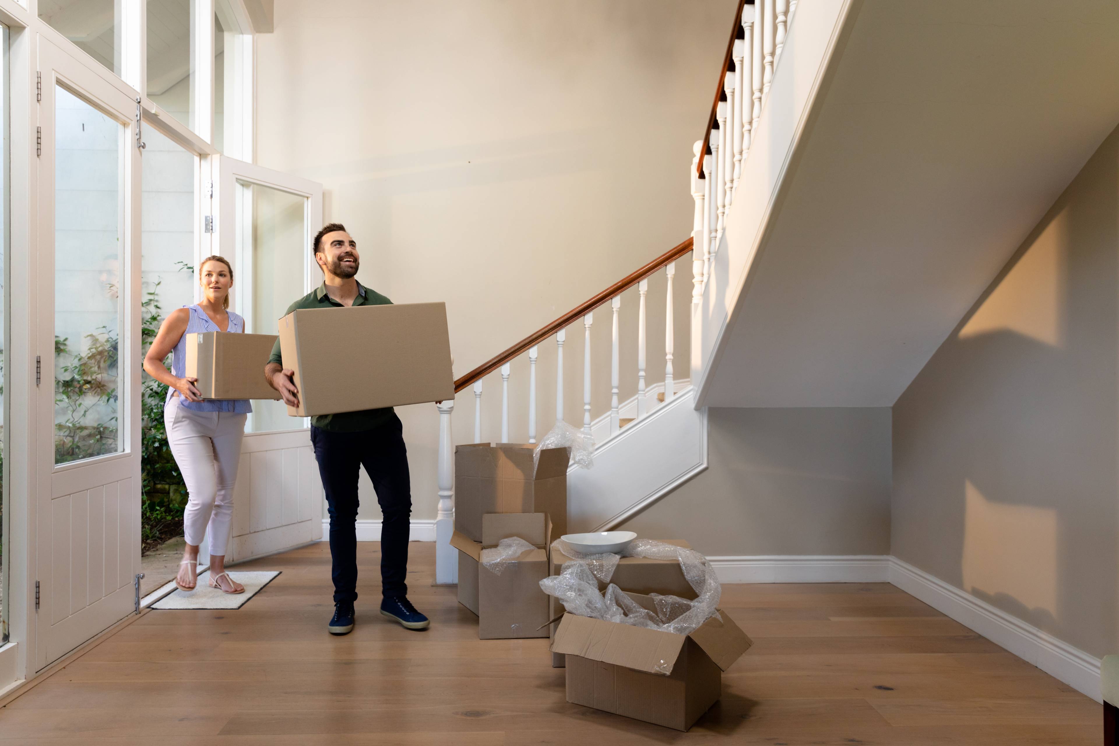 Couple arriving into new house