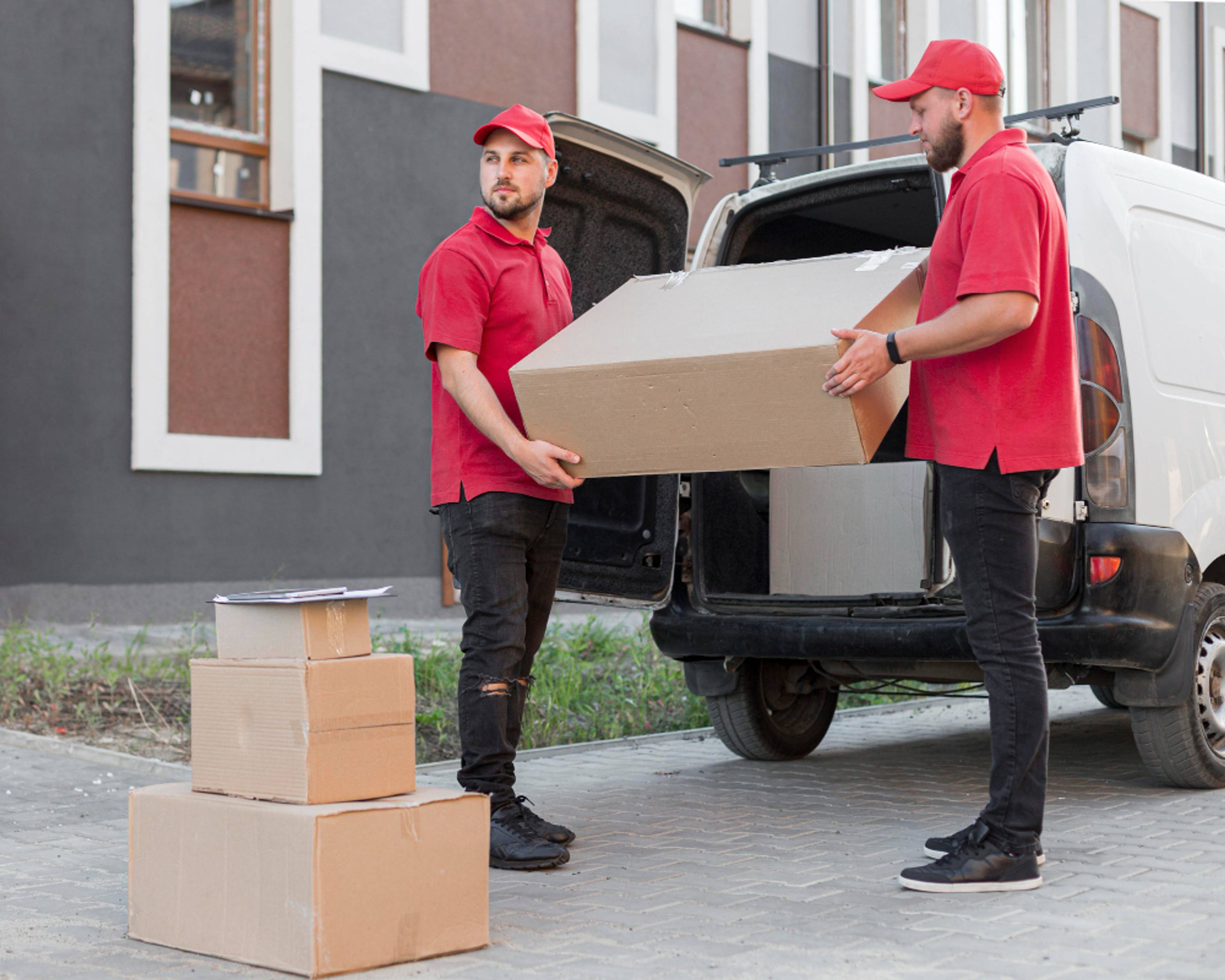 removals men in red shirts unloading van