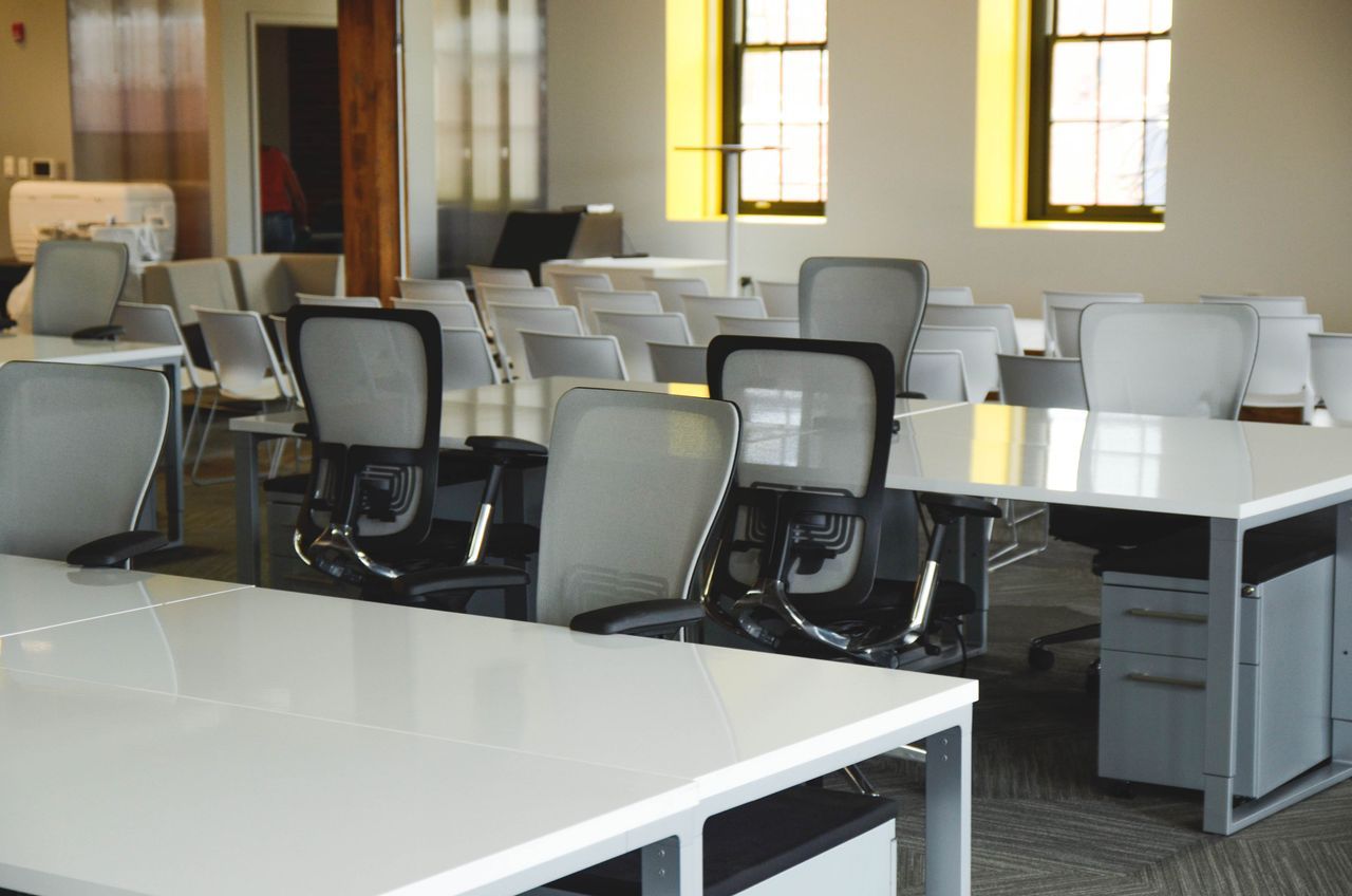 empty new office space with desks and chairs