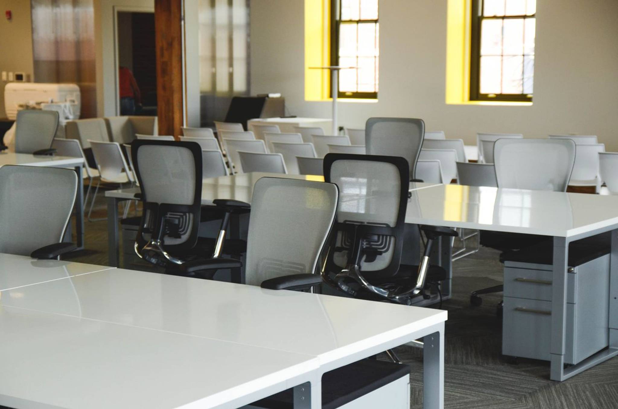 empty new office space with desks and chairs