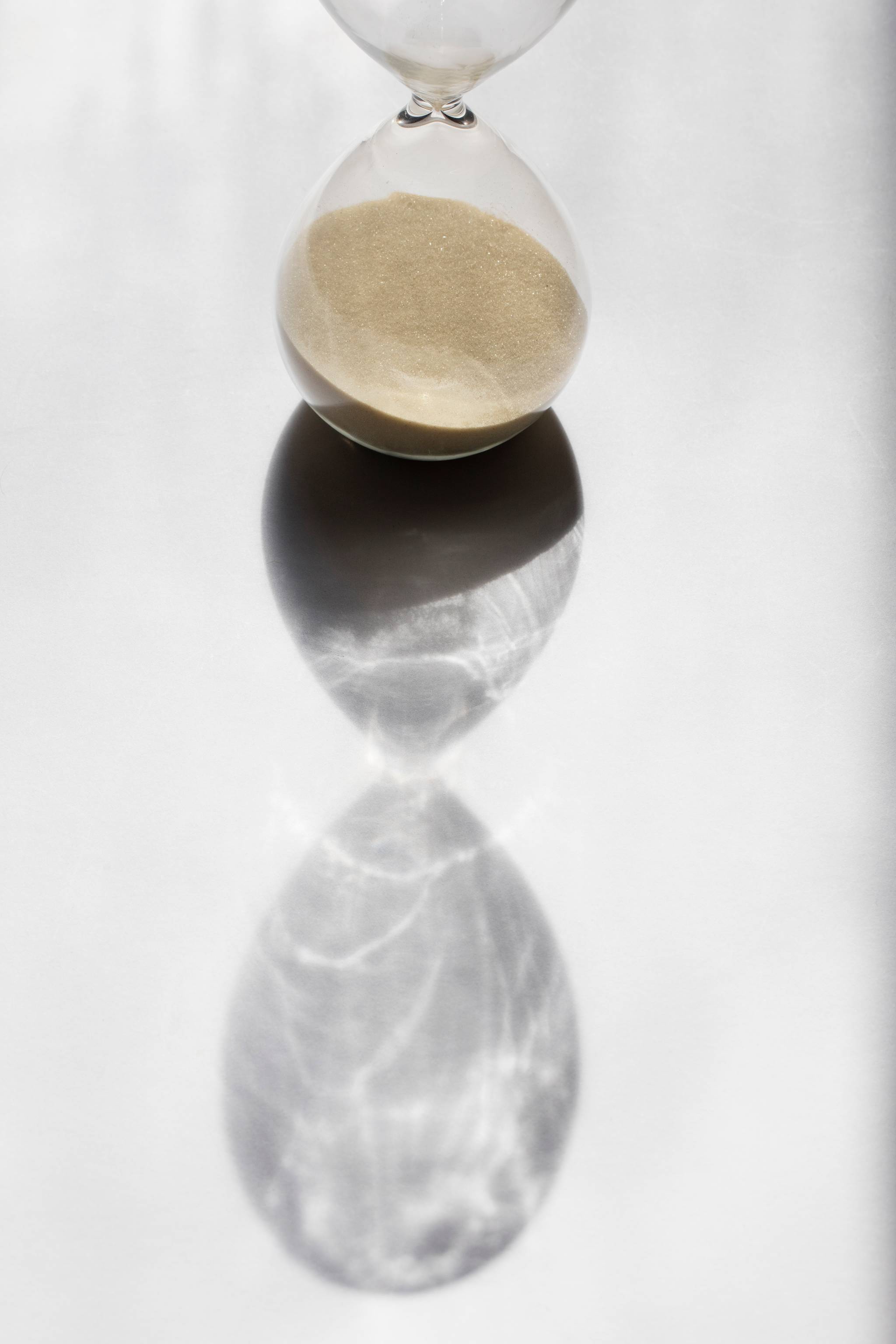 Hourglass casting shadow