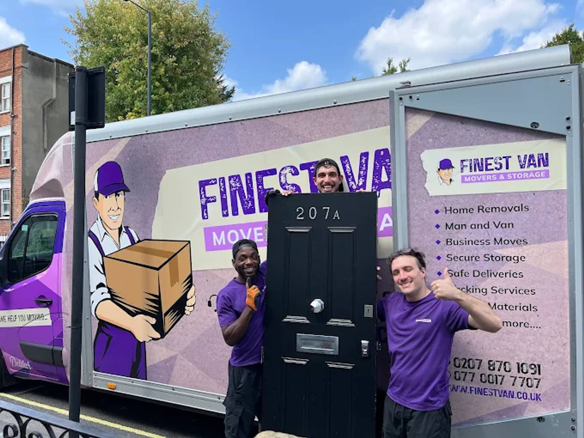 finest van removals workers holding front door in front of van