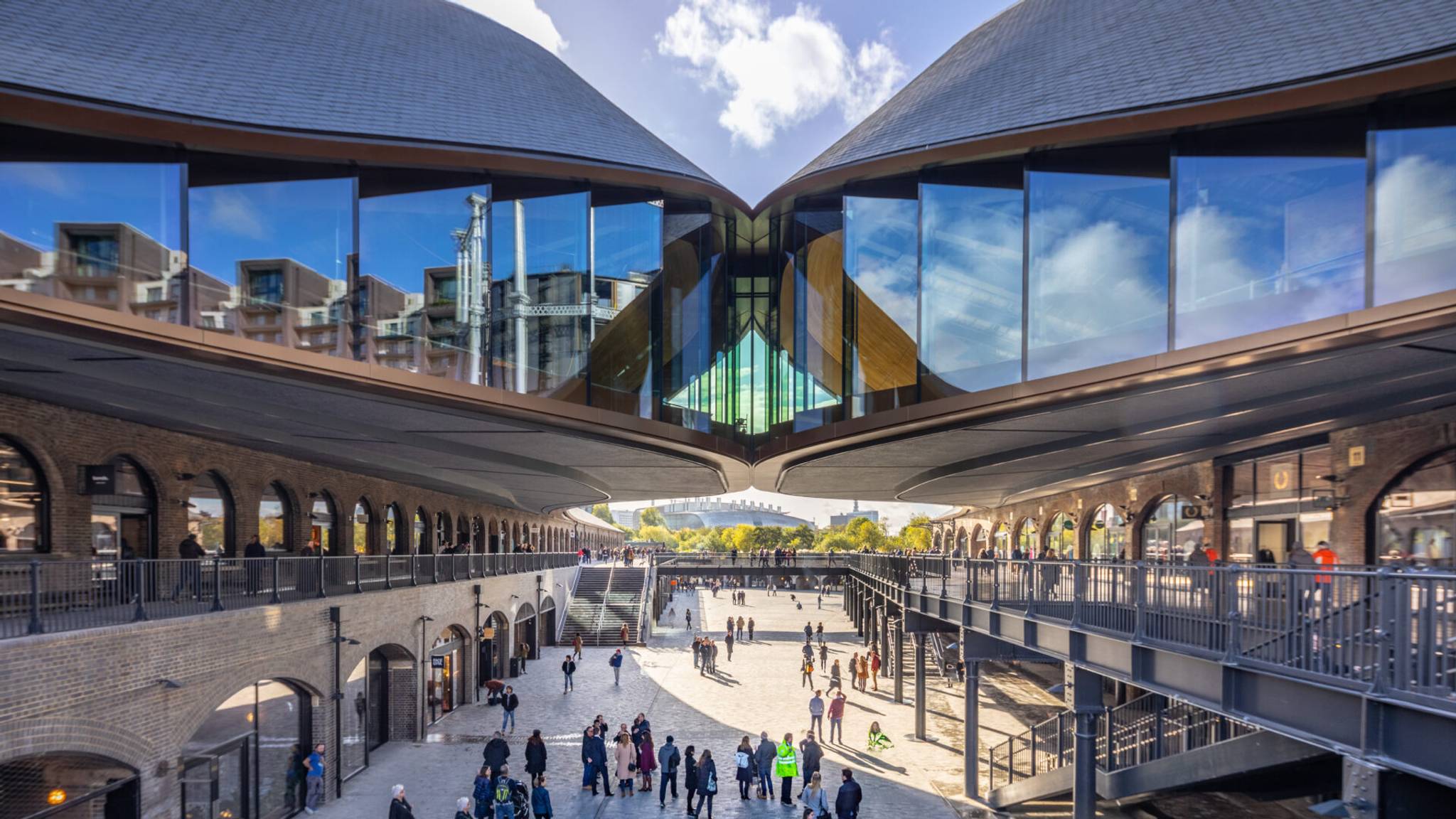 A view of Coal Drops Yard in London, England with its unique roof form