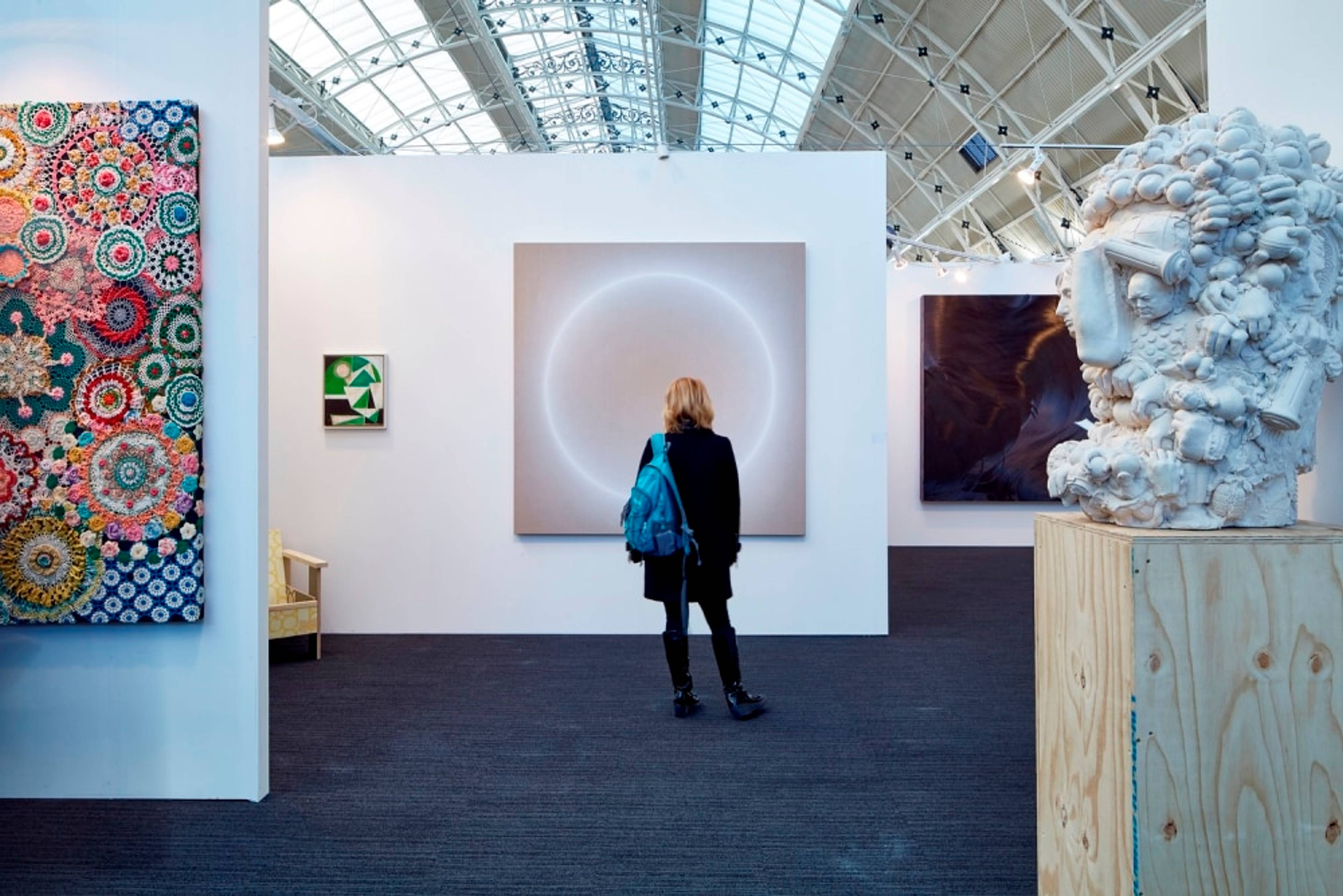 woman looking at art
