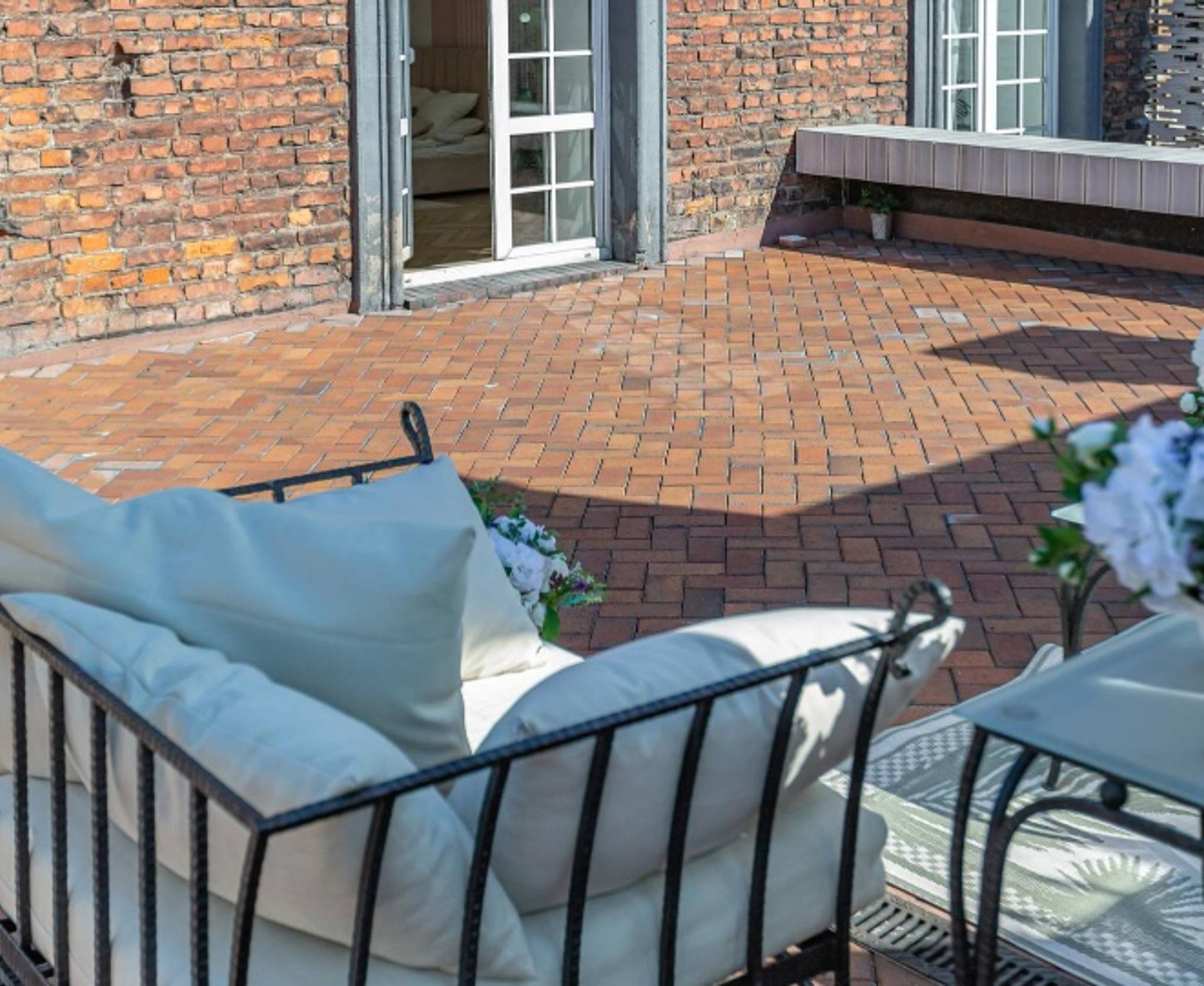 red brick patio with comfy chairs