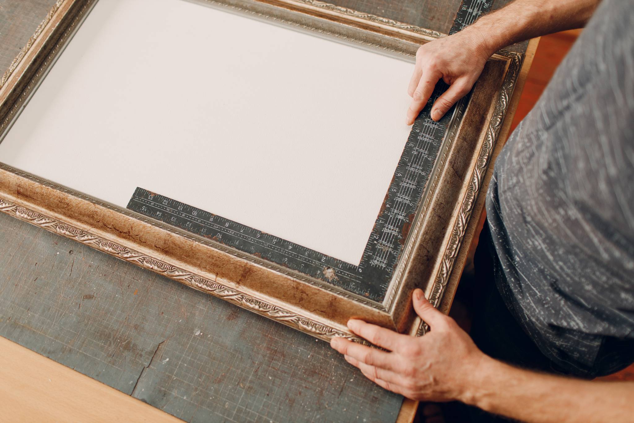 Man working on picture frame