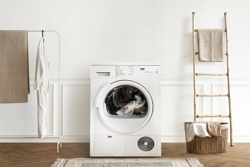 A washing machine cleaning clothes in a newly decorated room