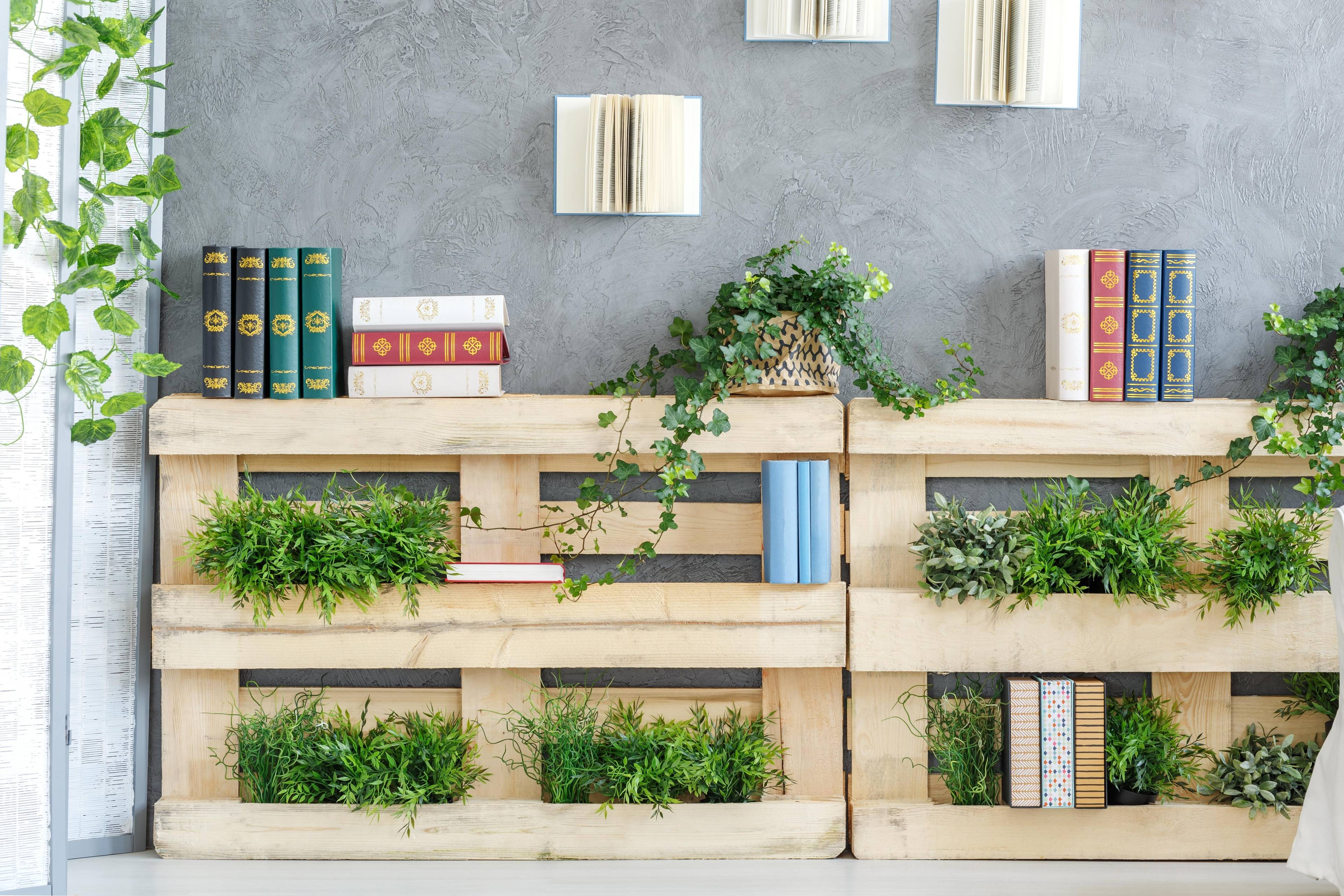 A wooden crate with books on it and a book on the bottom shelf.