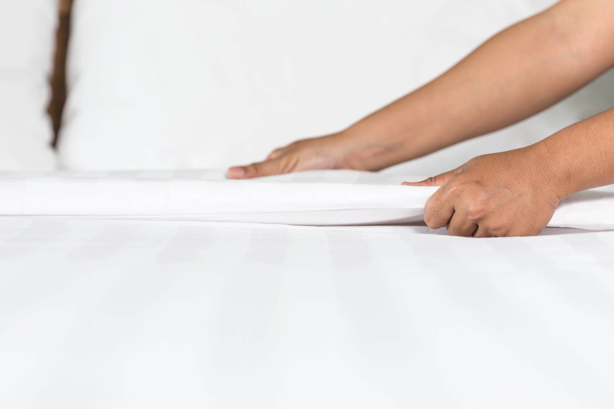 Man's hands on matteress