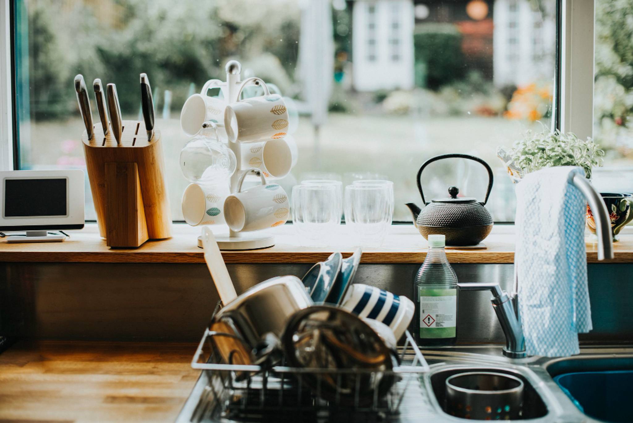 Kitchenware is stacked on a countertop