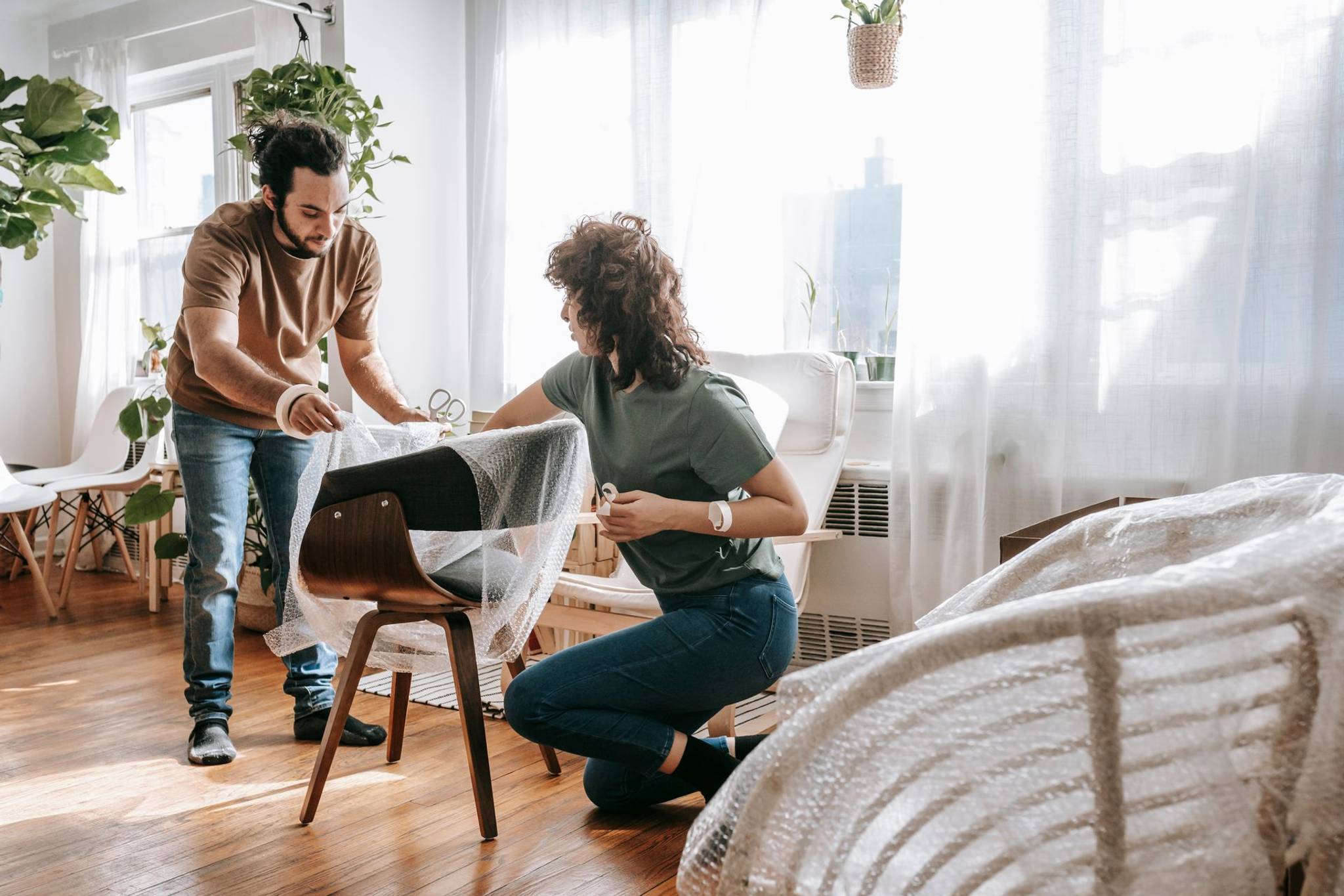couple preparing furniture for self storage 