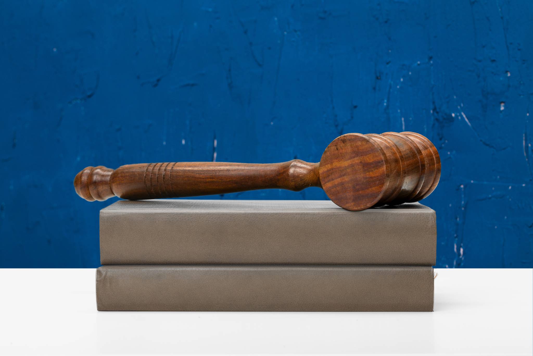Wooden gavel on top of books