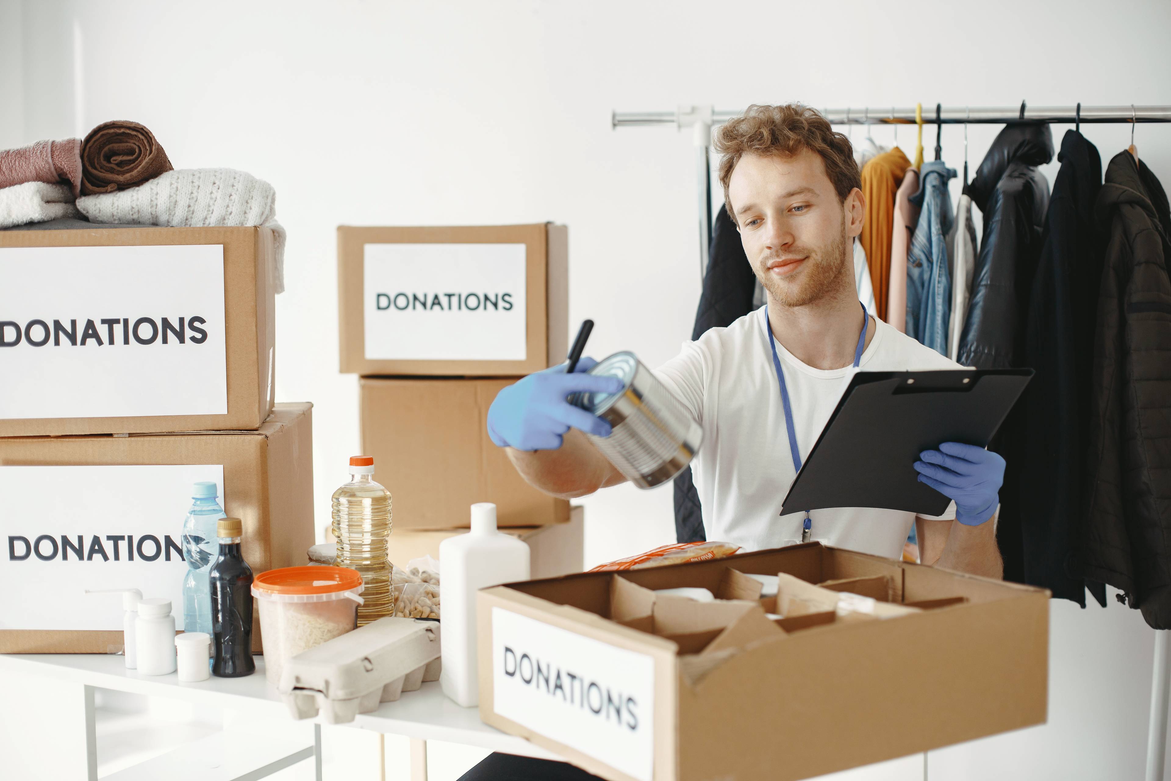 Guy collecting items that has been donated