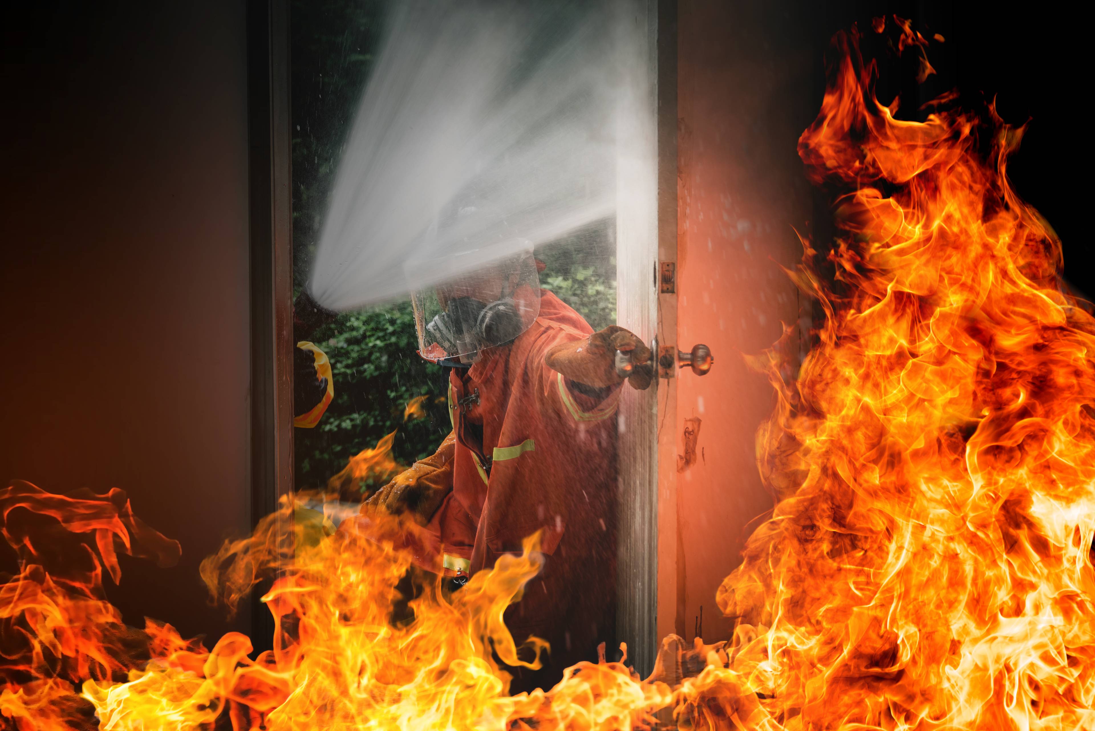 Fireman evacuating a burning room 