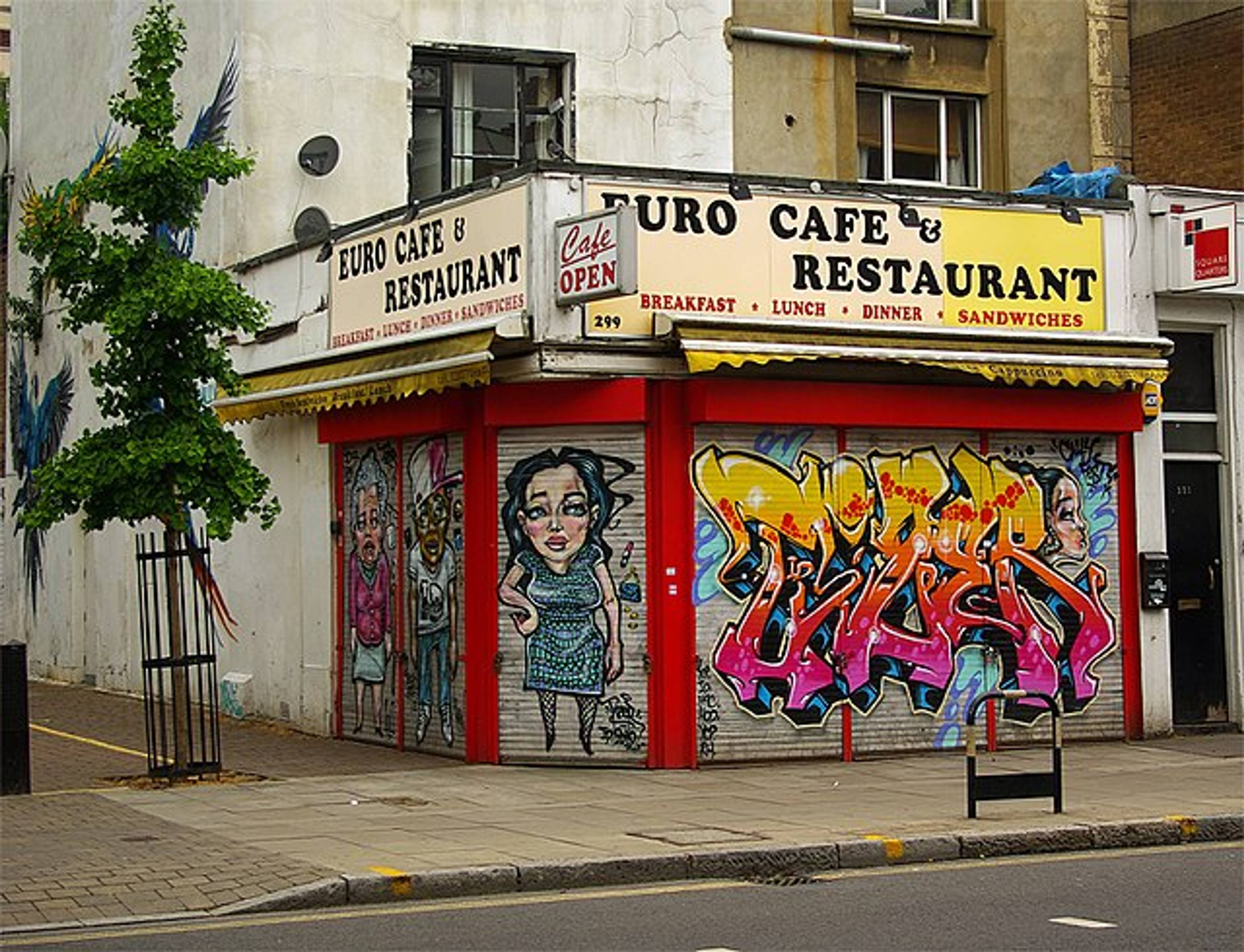 Graffiti art on the security shutters of a Caledonian Road restaurant