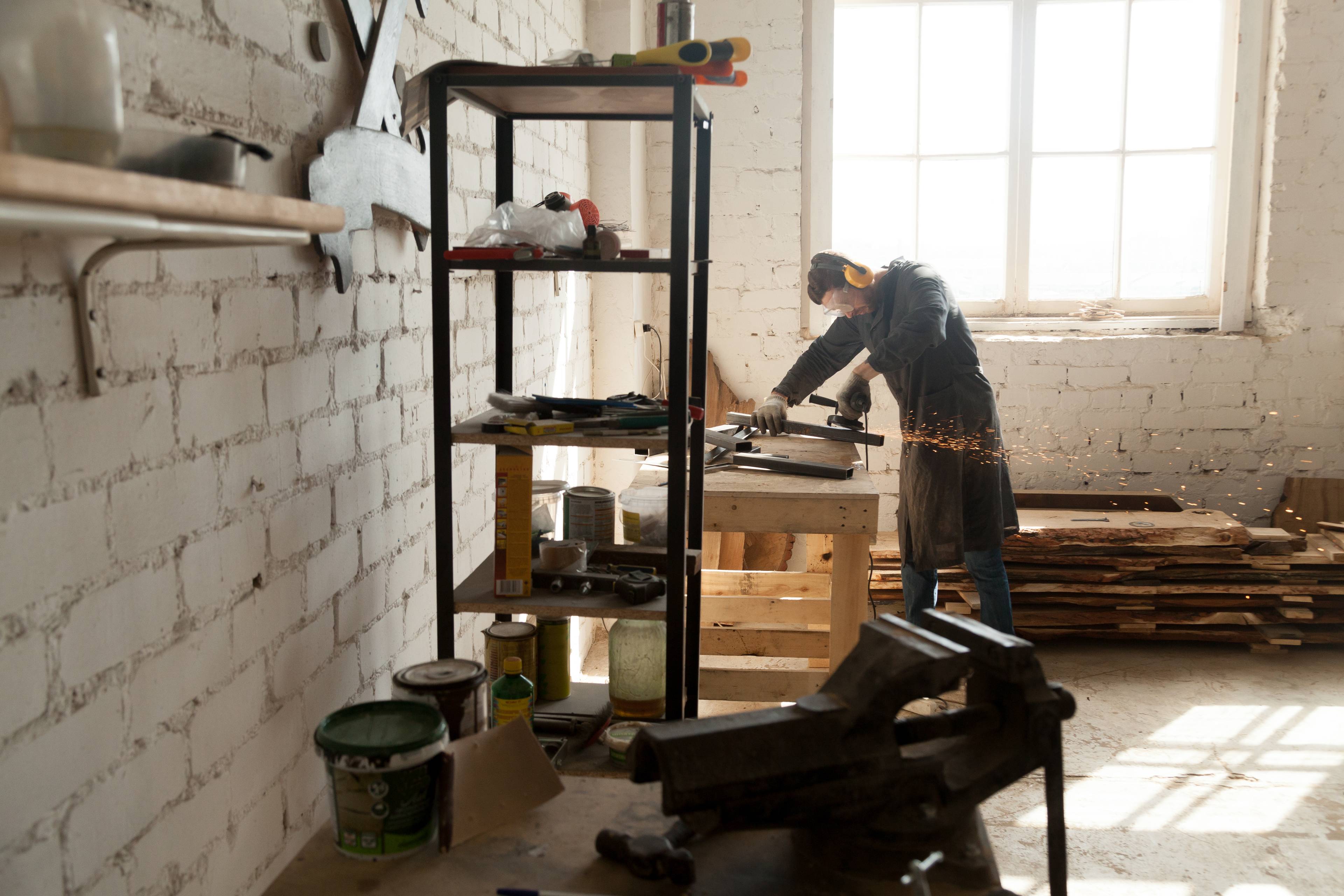 Workman using tools at bench