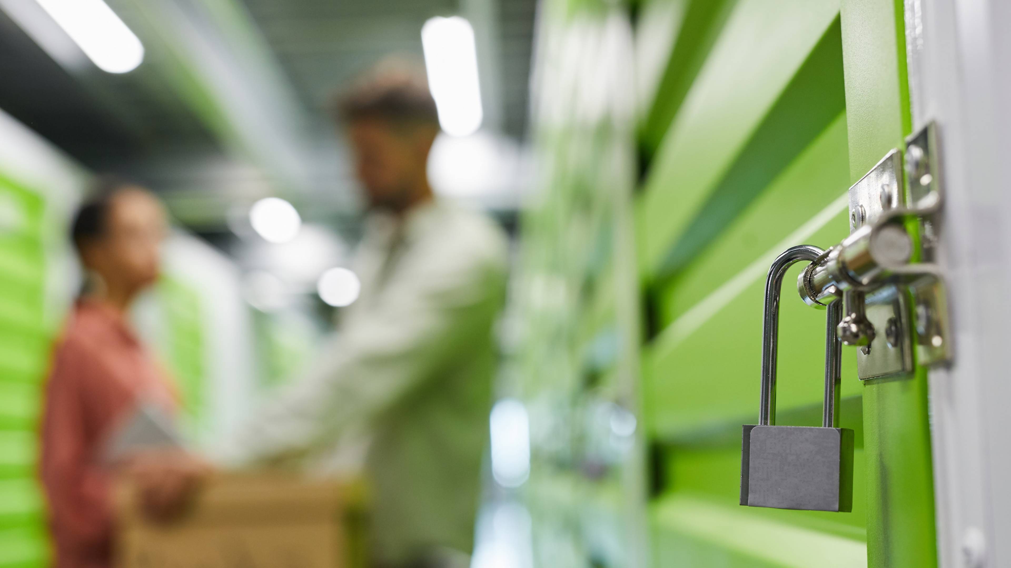 Close up lock and key in a storage unit facility