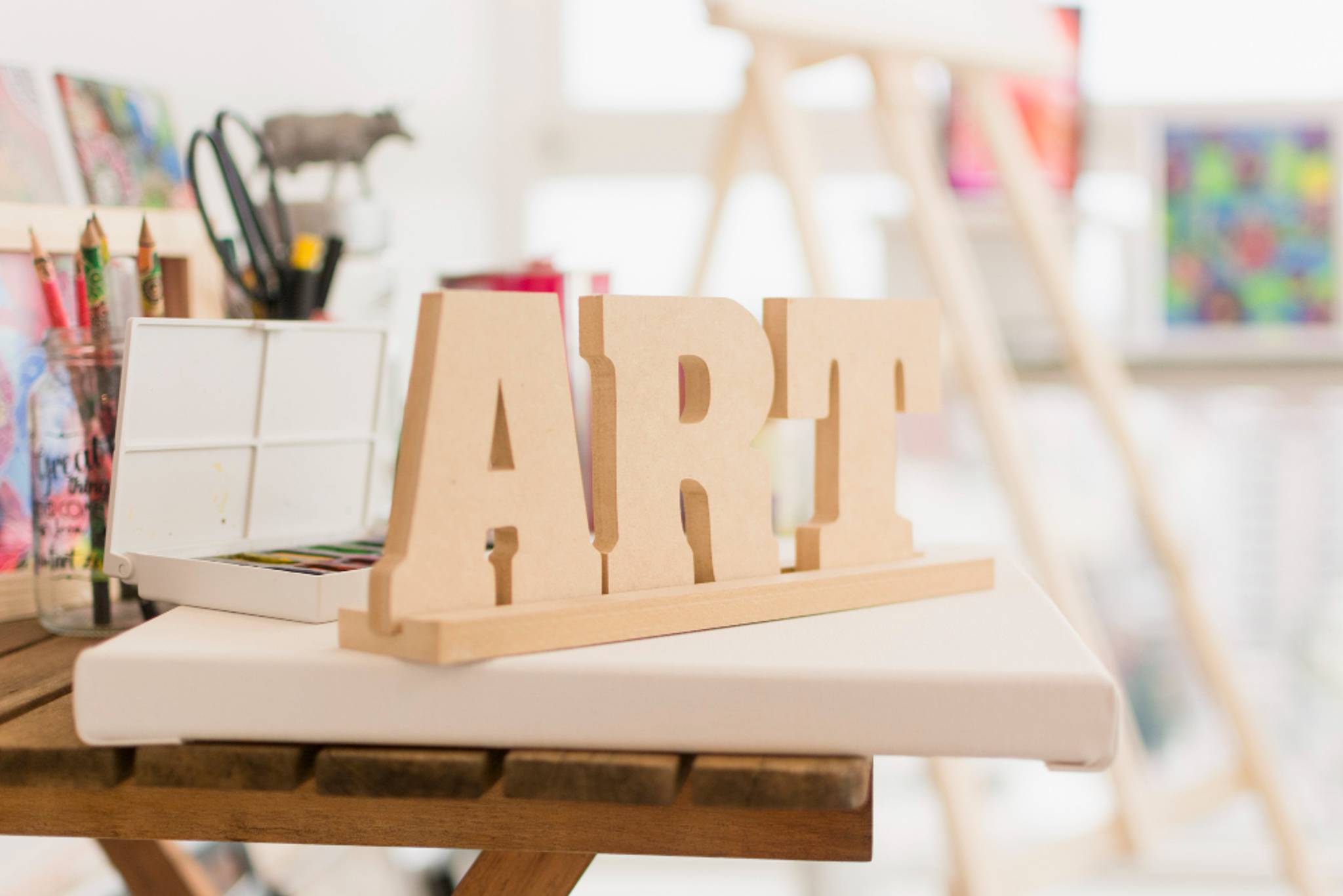 Wooden art sign in a comfy, warm room