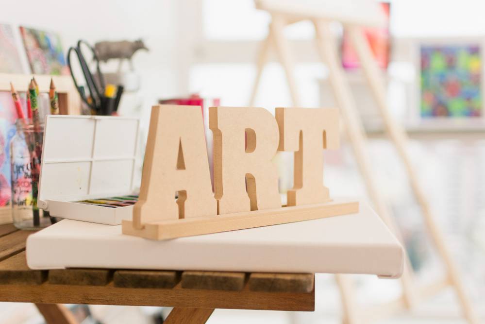 Wooden art sign in a comfy, warm room
