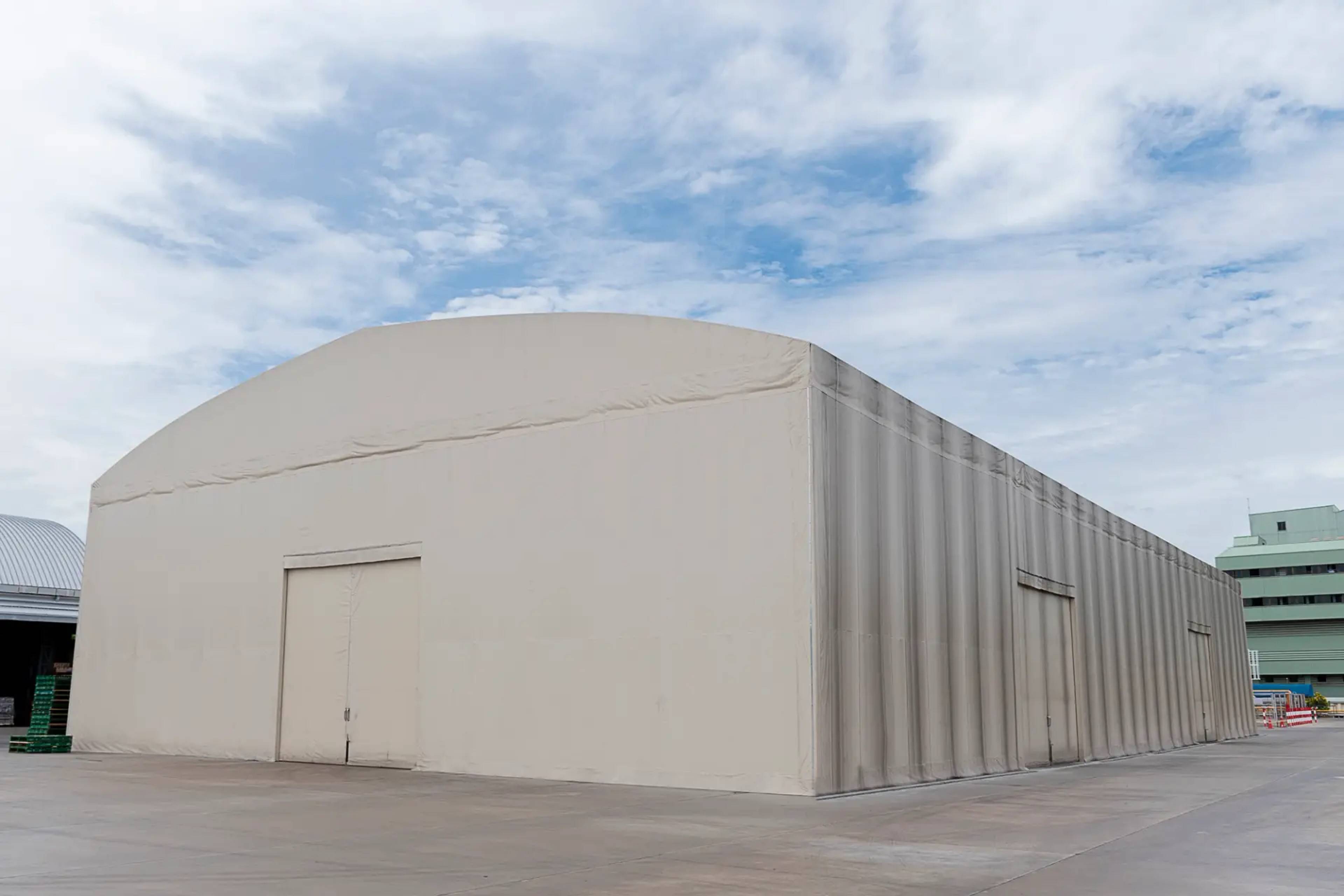 An old, grey, storage facility