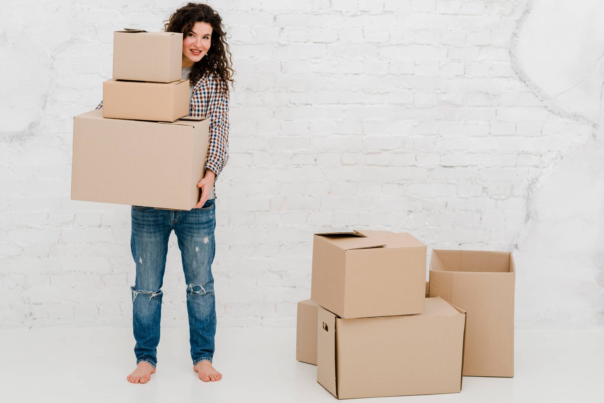 Woman carrying some boxes