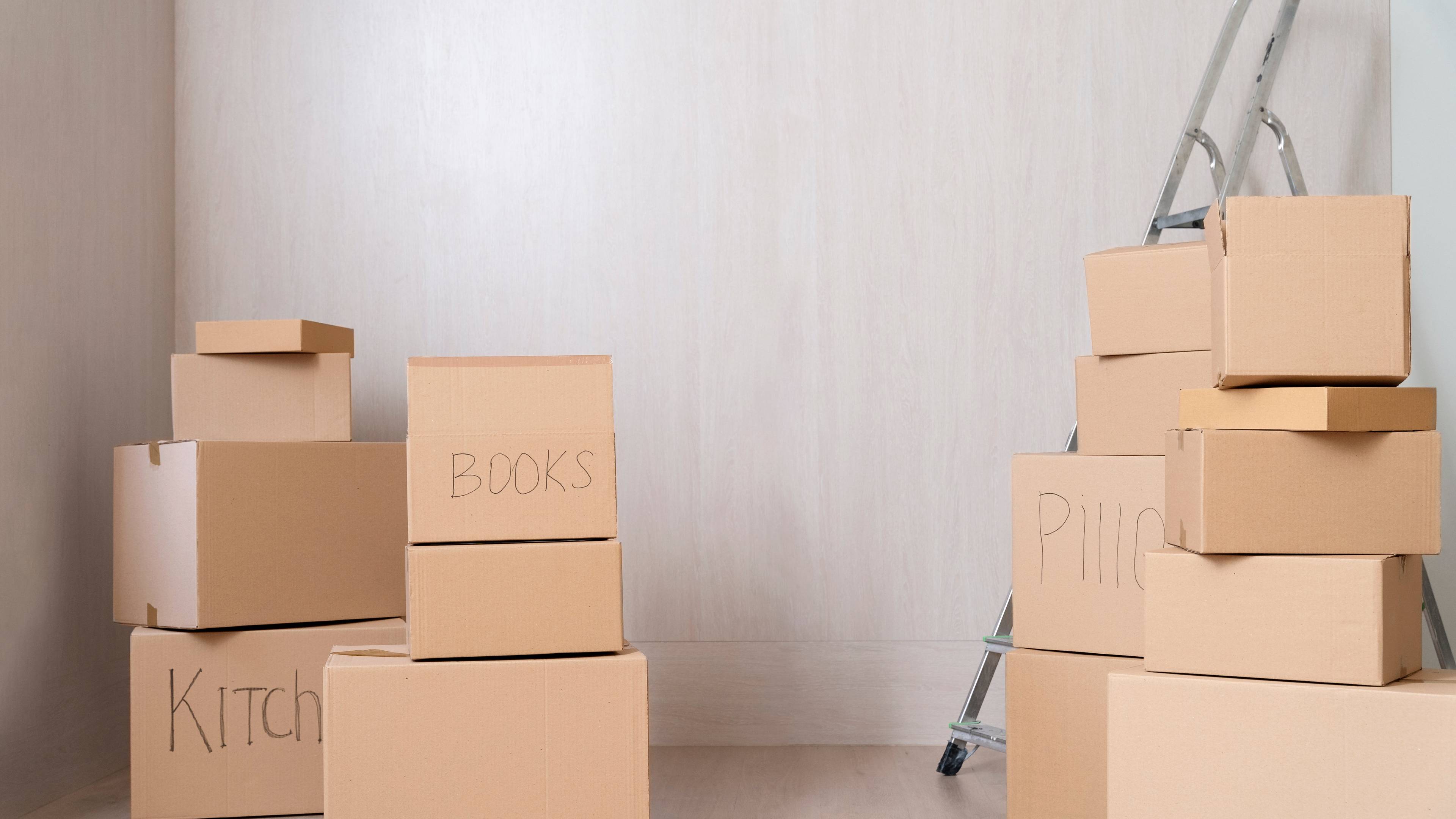 boxes in room with step ladder