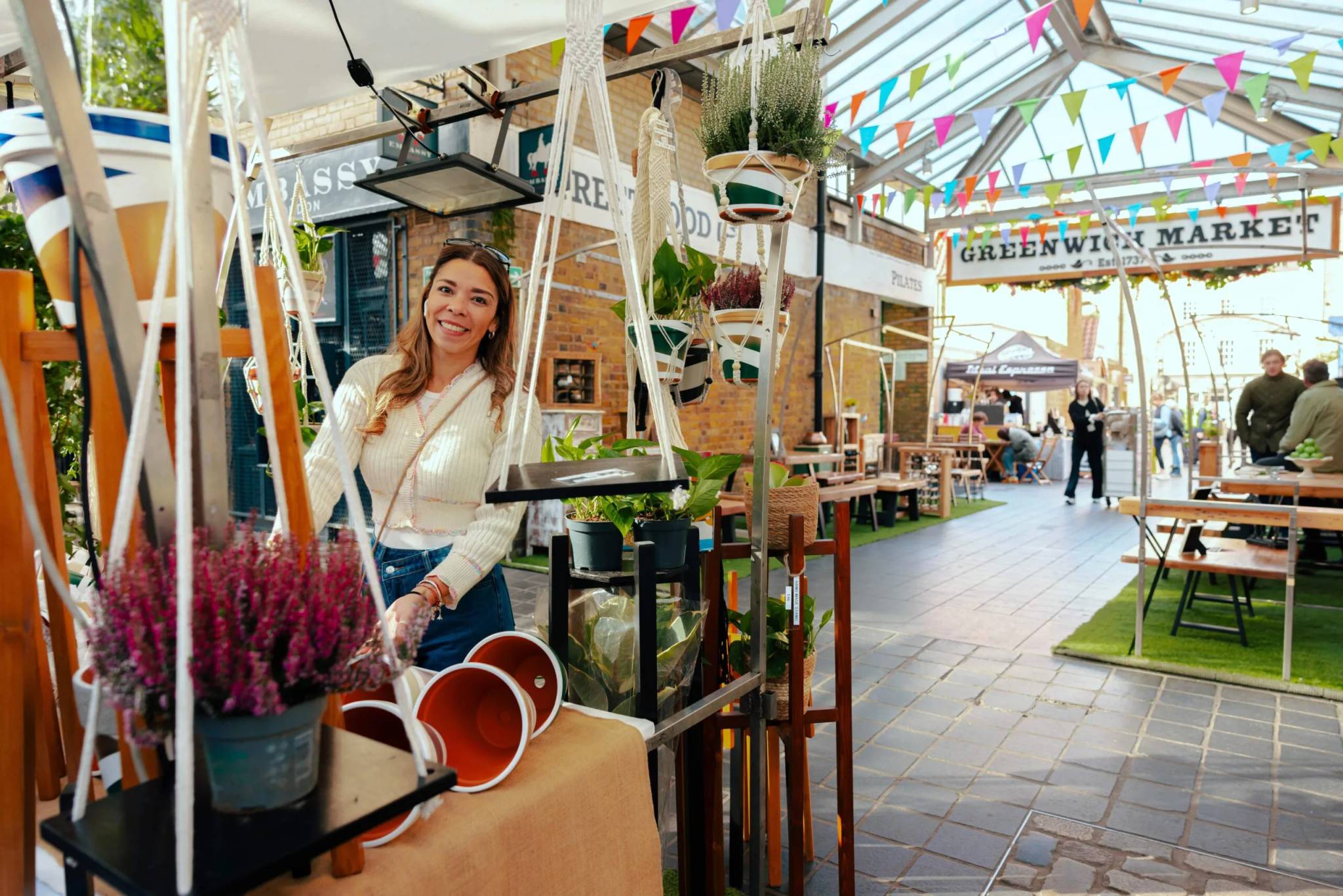 smiling woman at greenwhich market stall