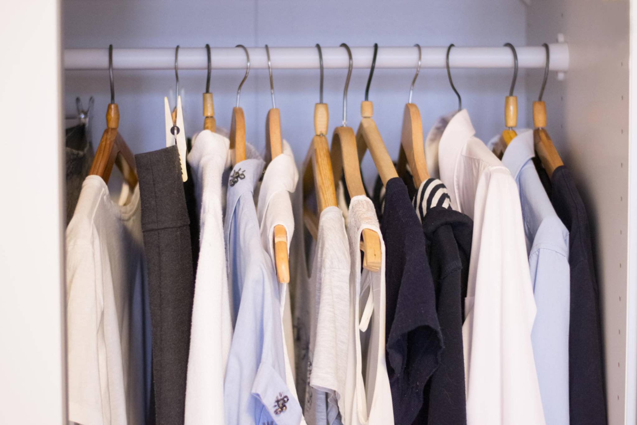 clothes on hangers in storage