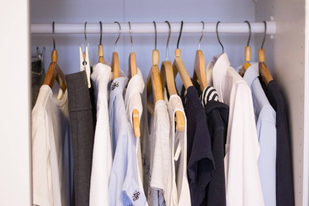 clothes on hangers in storage