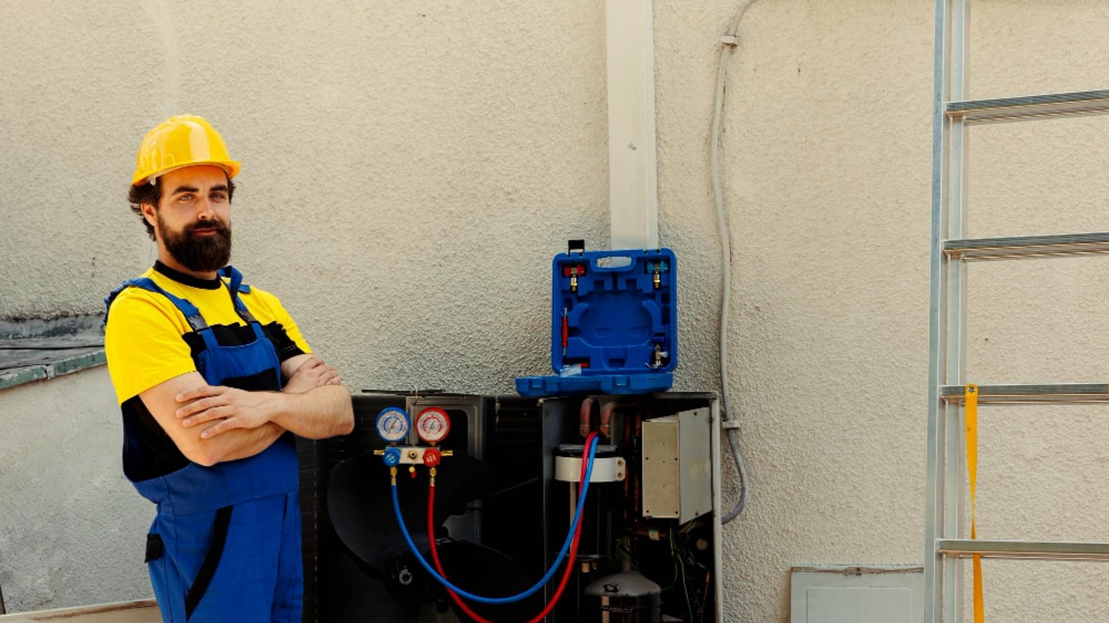 An electrician fixing a generator attached to a wall
