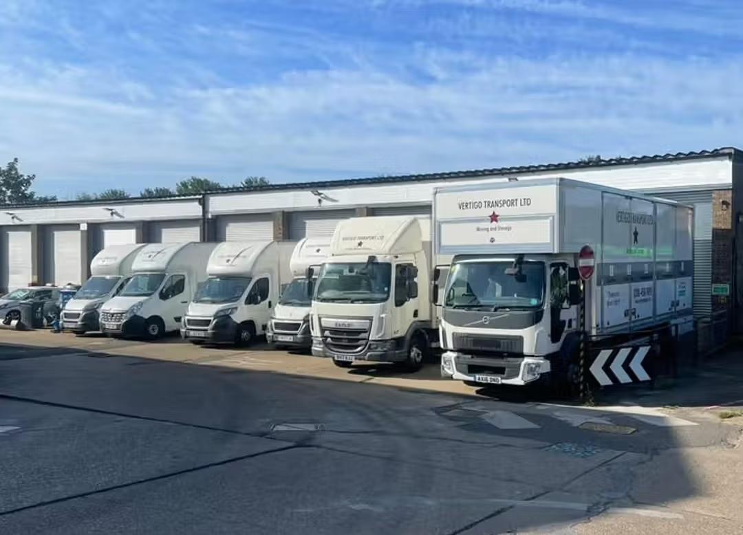 vertigo transport removals vans and lorries in outside garage 