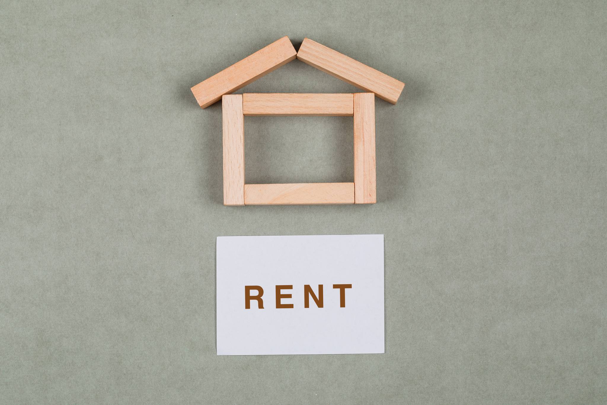 Renting a house concept using wooden blocks