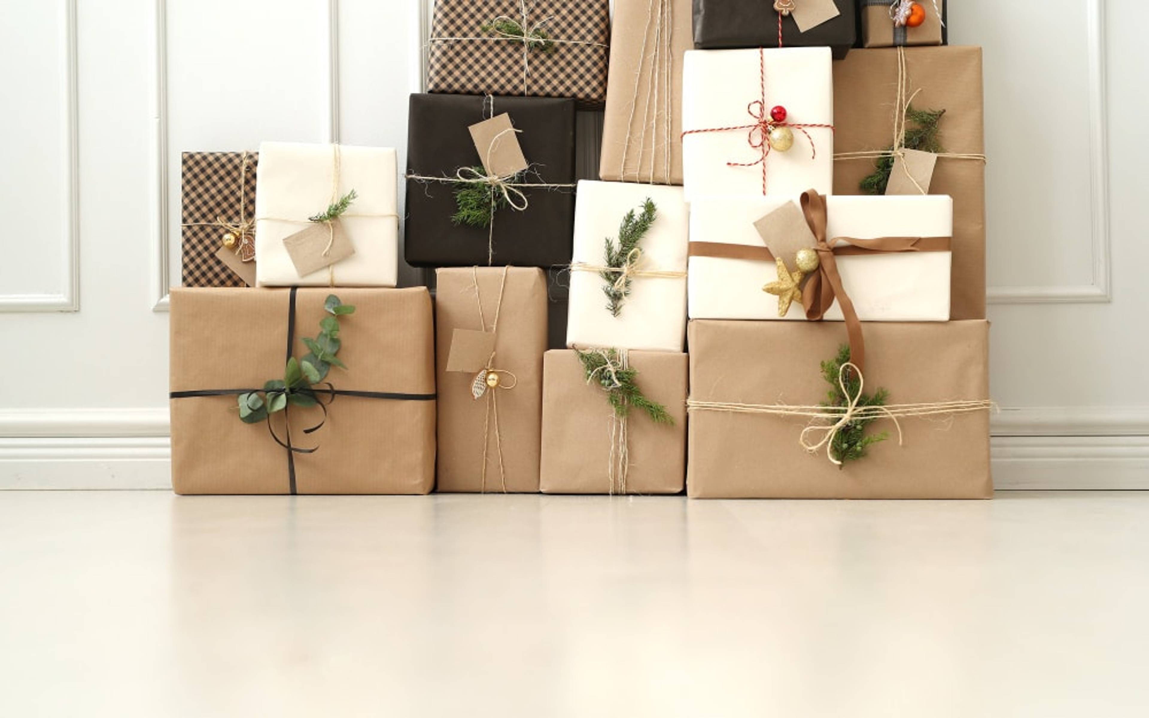 Stack on parcels wrapped up in paper against a wall