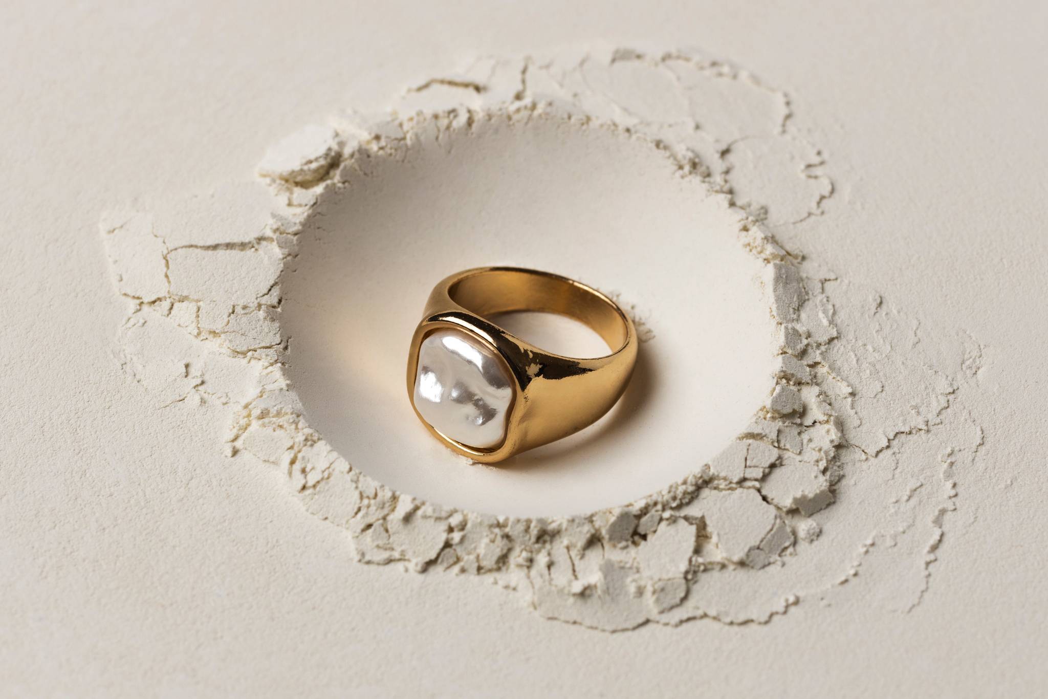 A gold ring inside a small hole