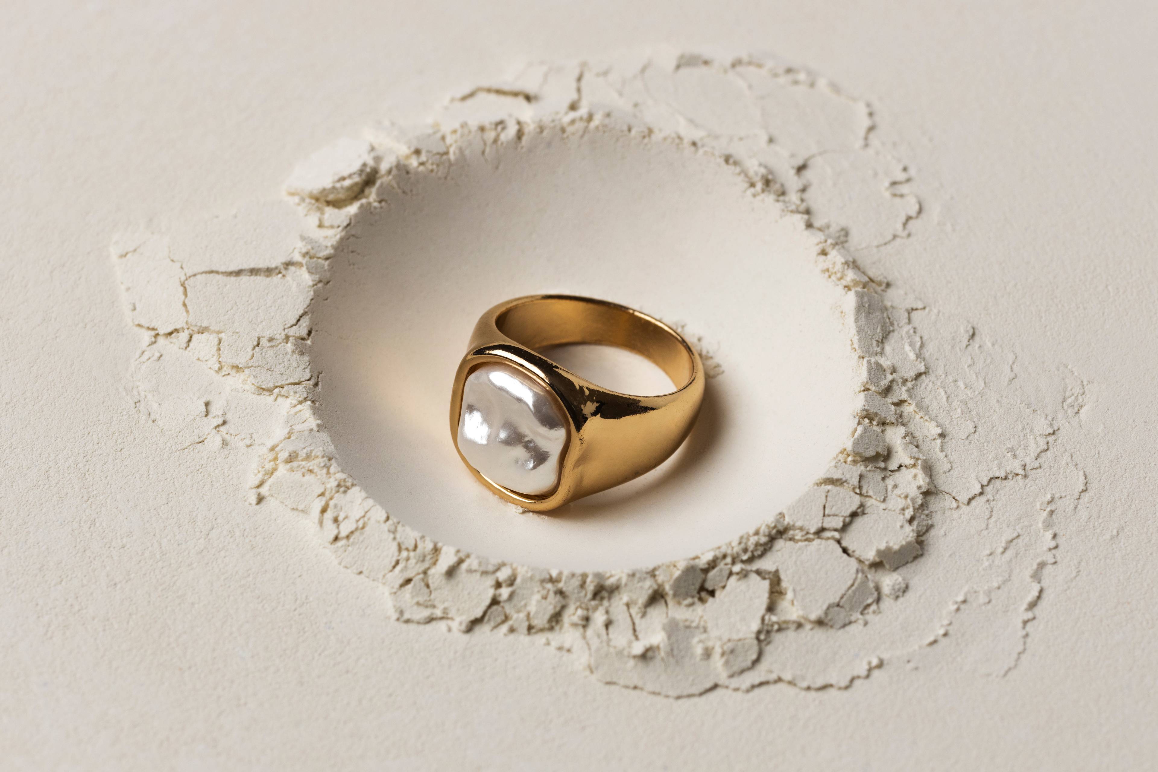 A gold ring inside a small hole
