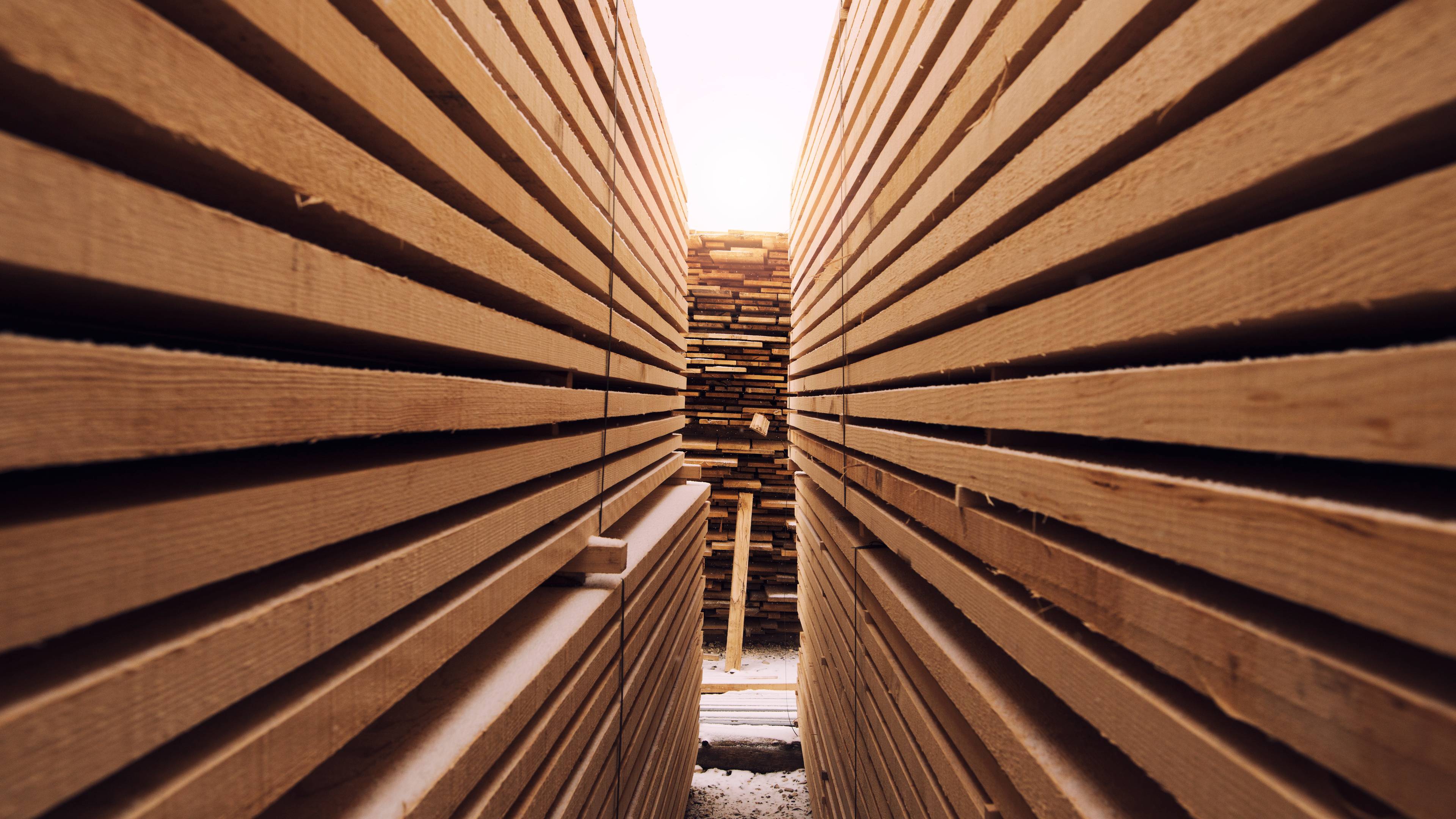 Stack of wooden planks in sawmill lumber yard