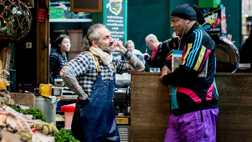 traders speaking to each other at borough market