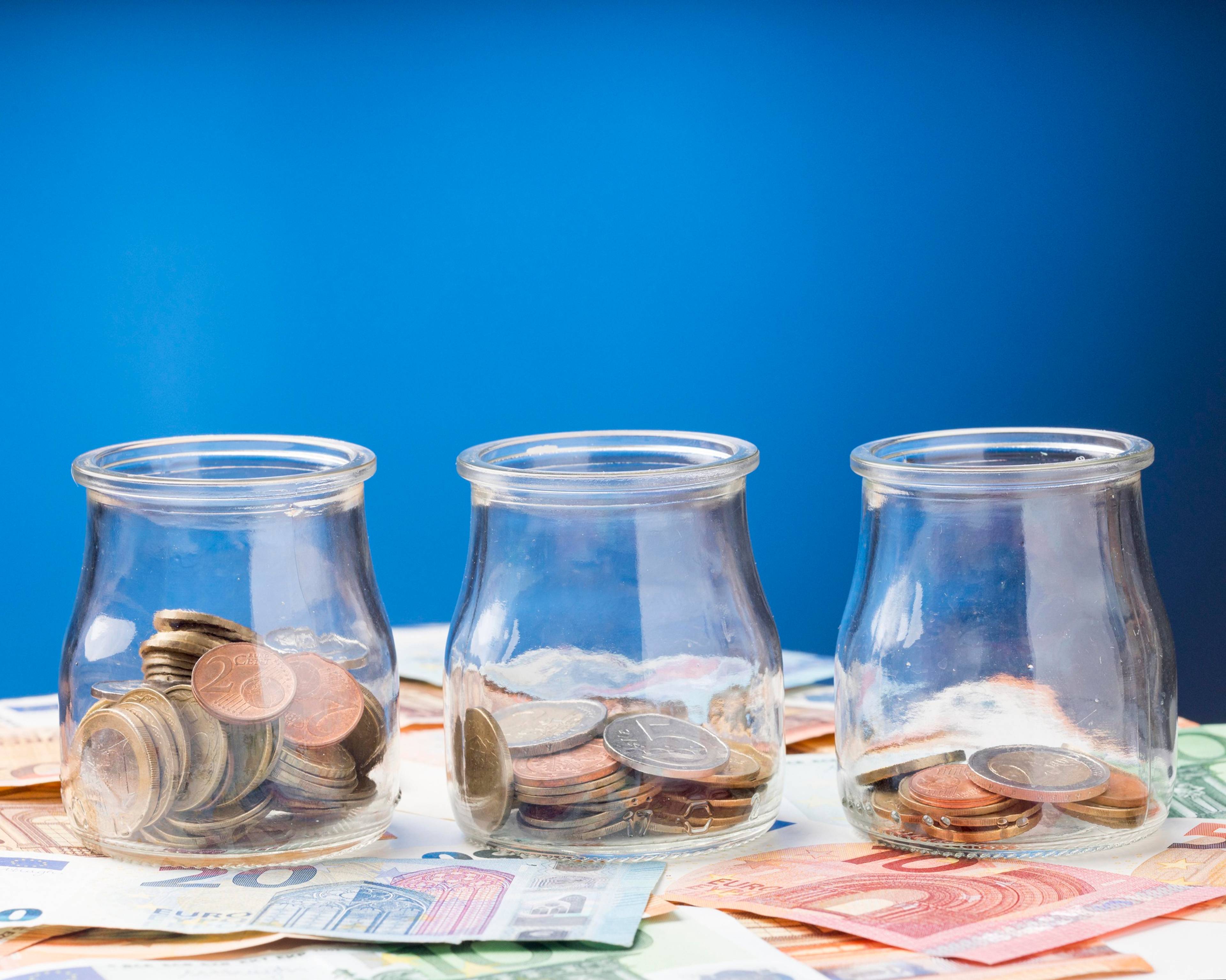 Jar with coins and banknotes