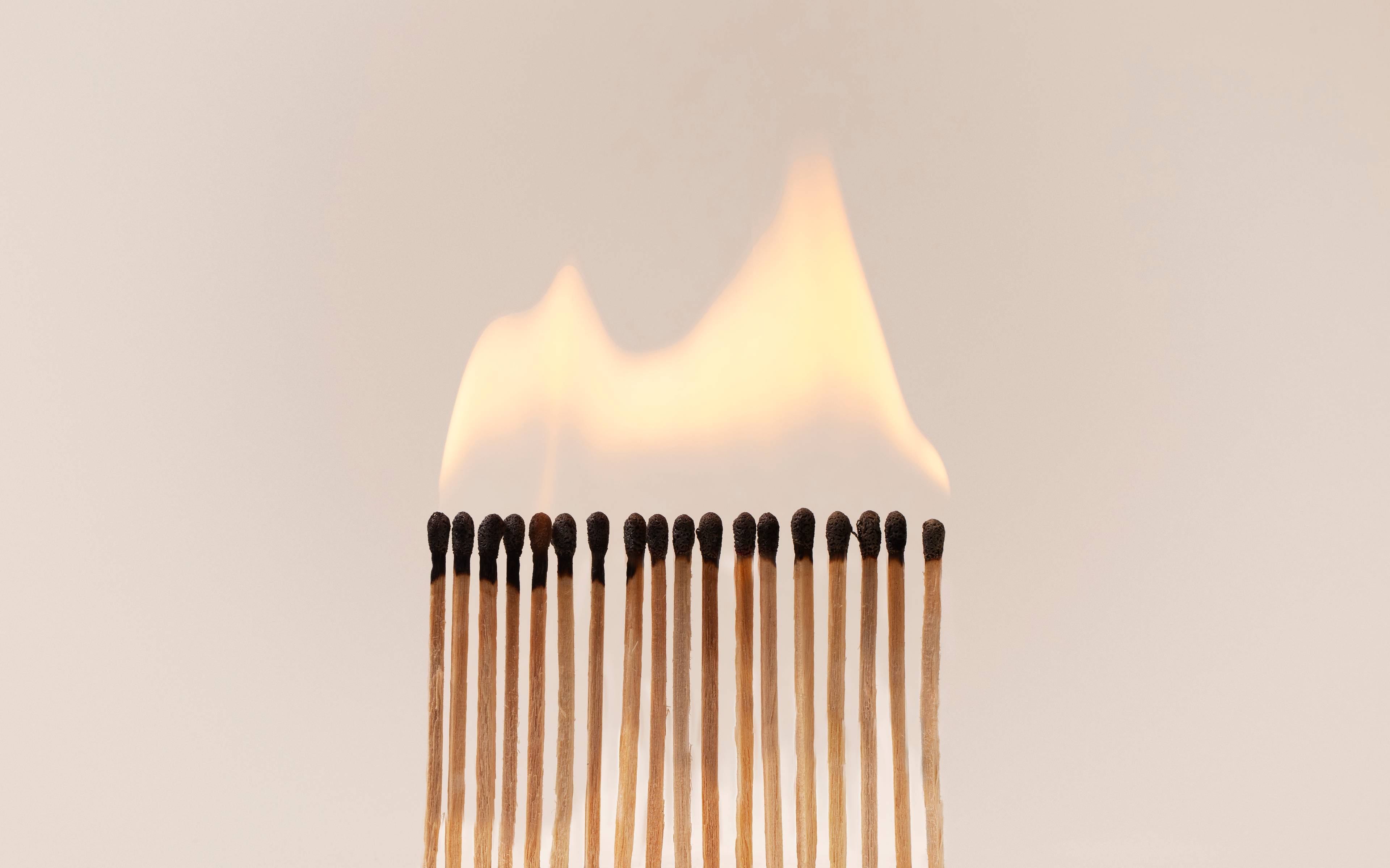 Arrangement of burning matches