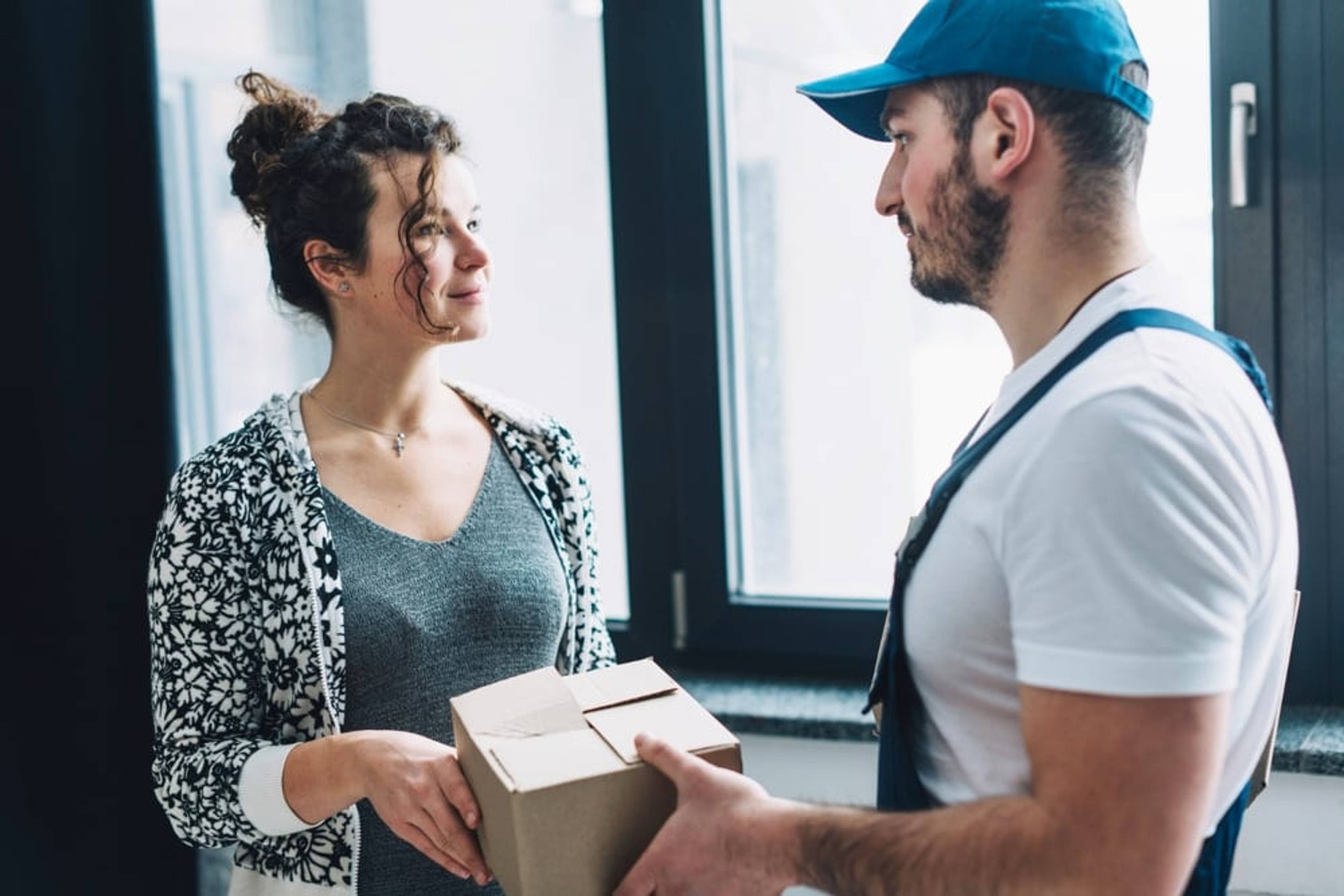 Man giving package to a woman