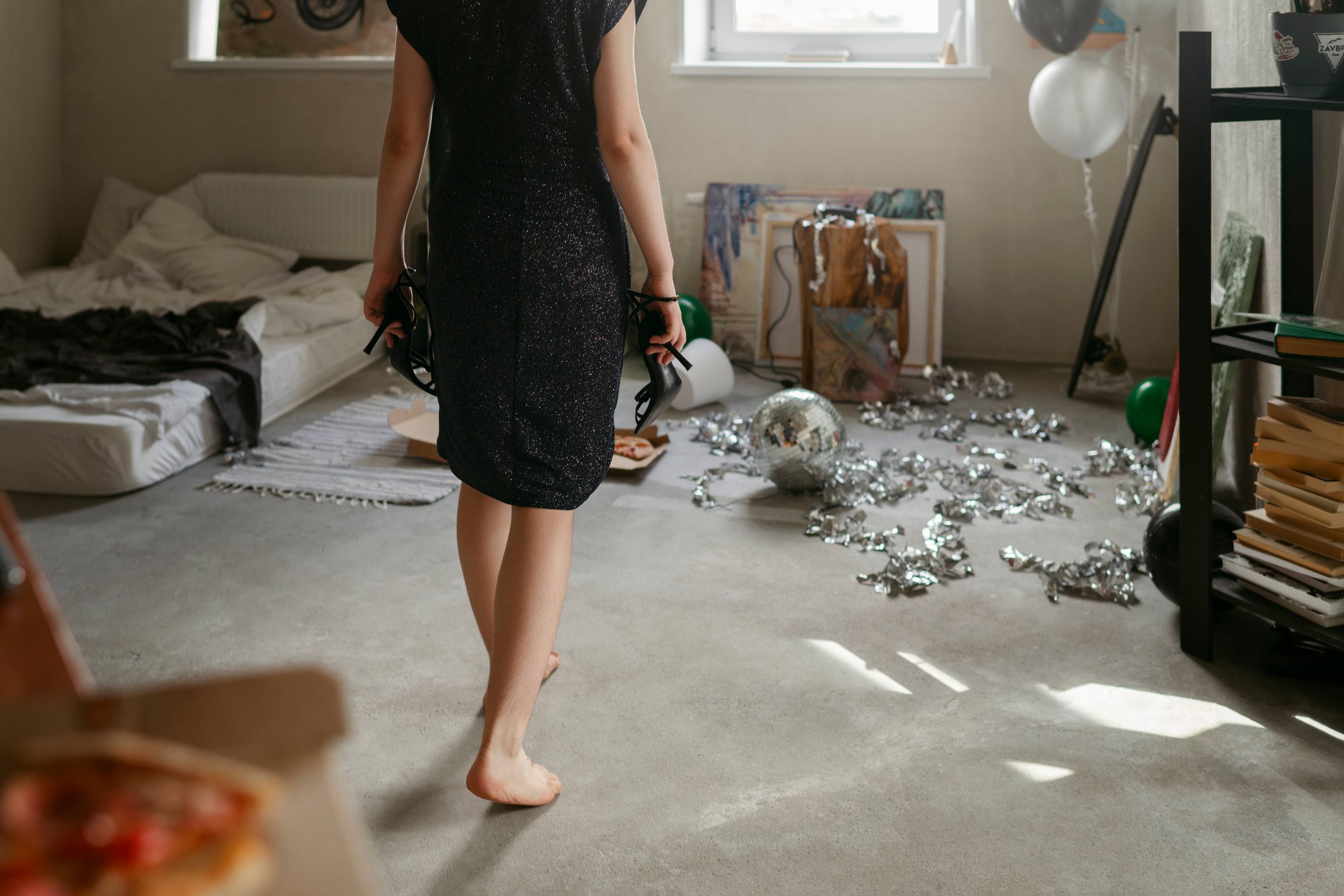 Woman cleaning a messy room