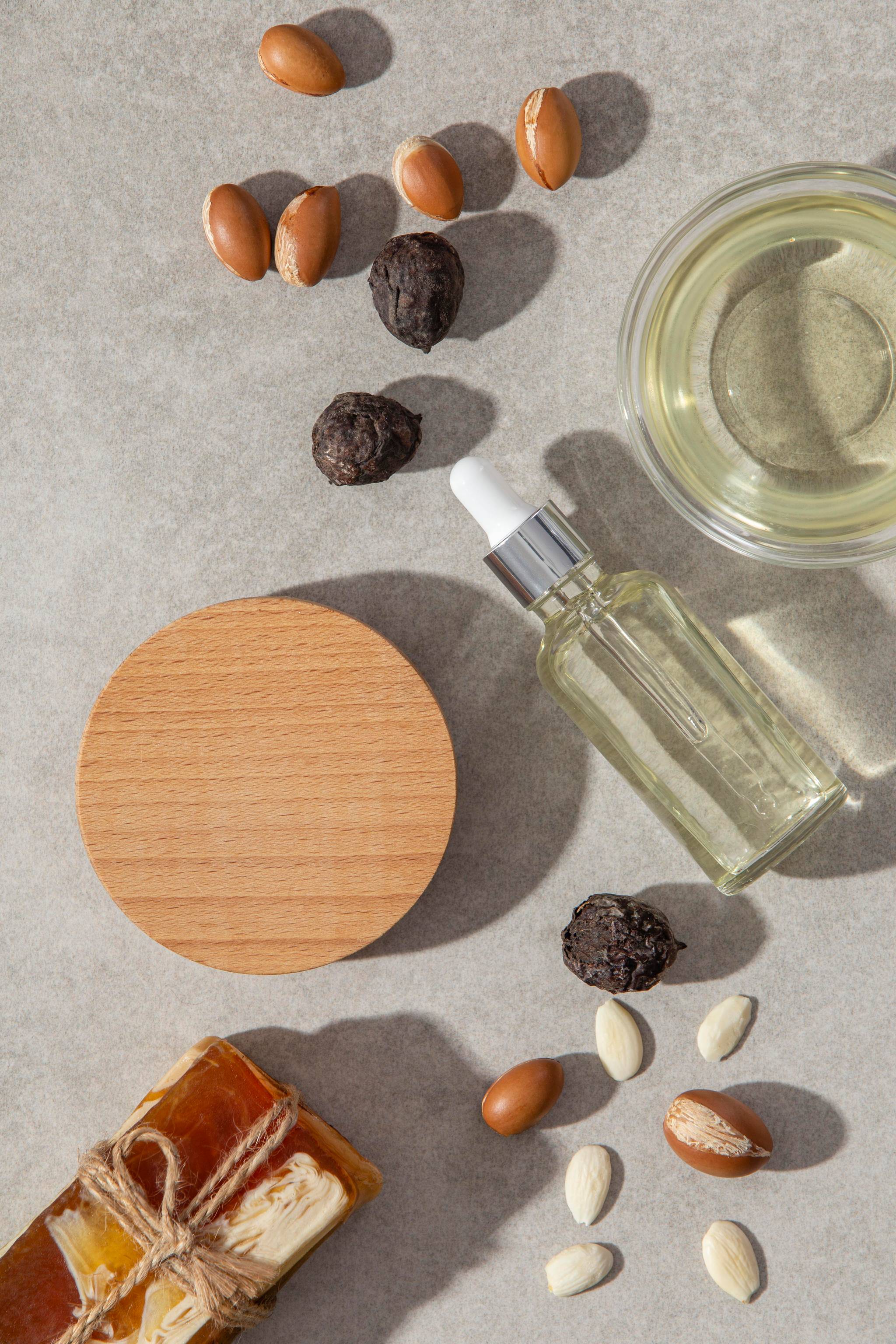 Flat lay of essential oils and cedar blocks, with a variety of seeds.